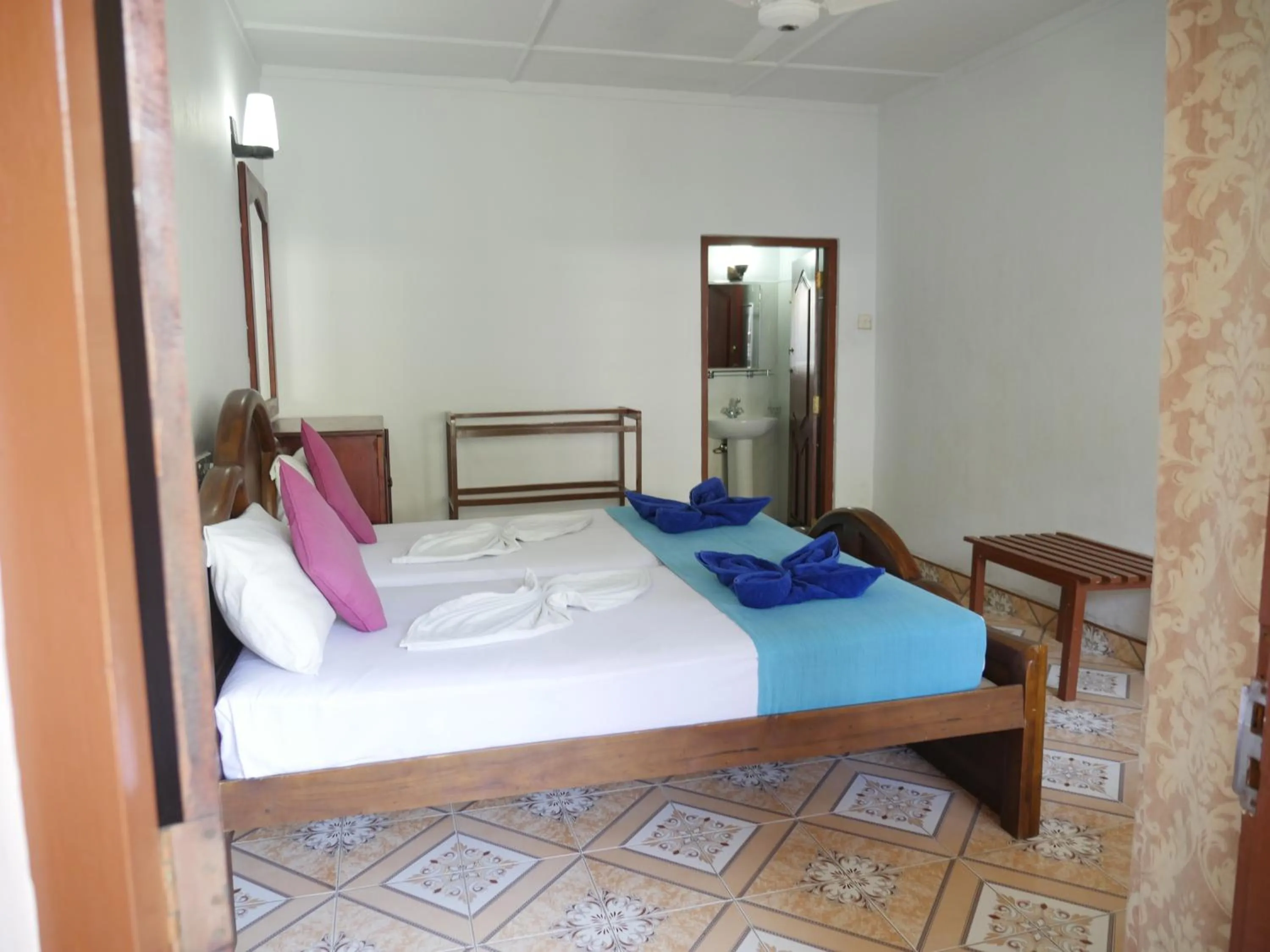 Bed in Ocean View tourist guest house at Negombo beach near the airport