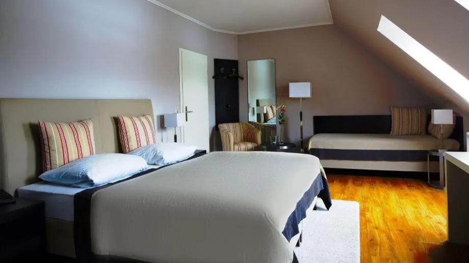 Bed in AUSZEIT Hotel