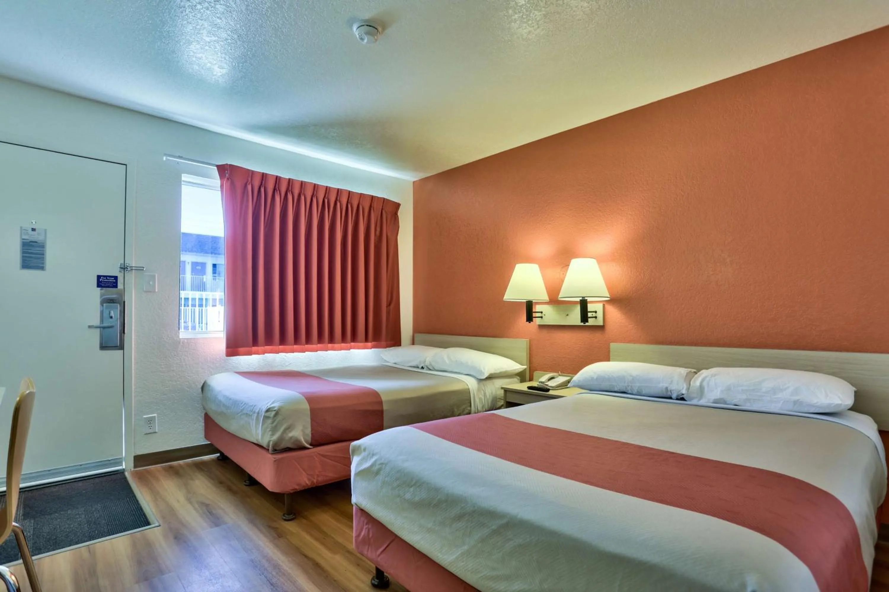 Seating area, Bed in Motel 6-Flagstaff, AZ - Butler