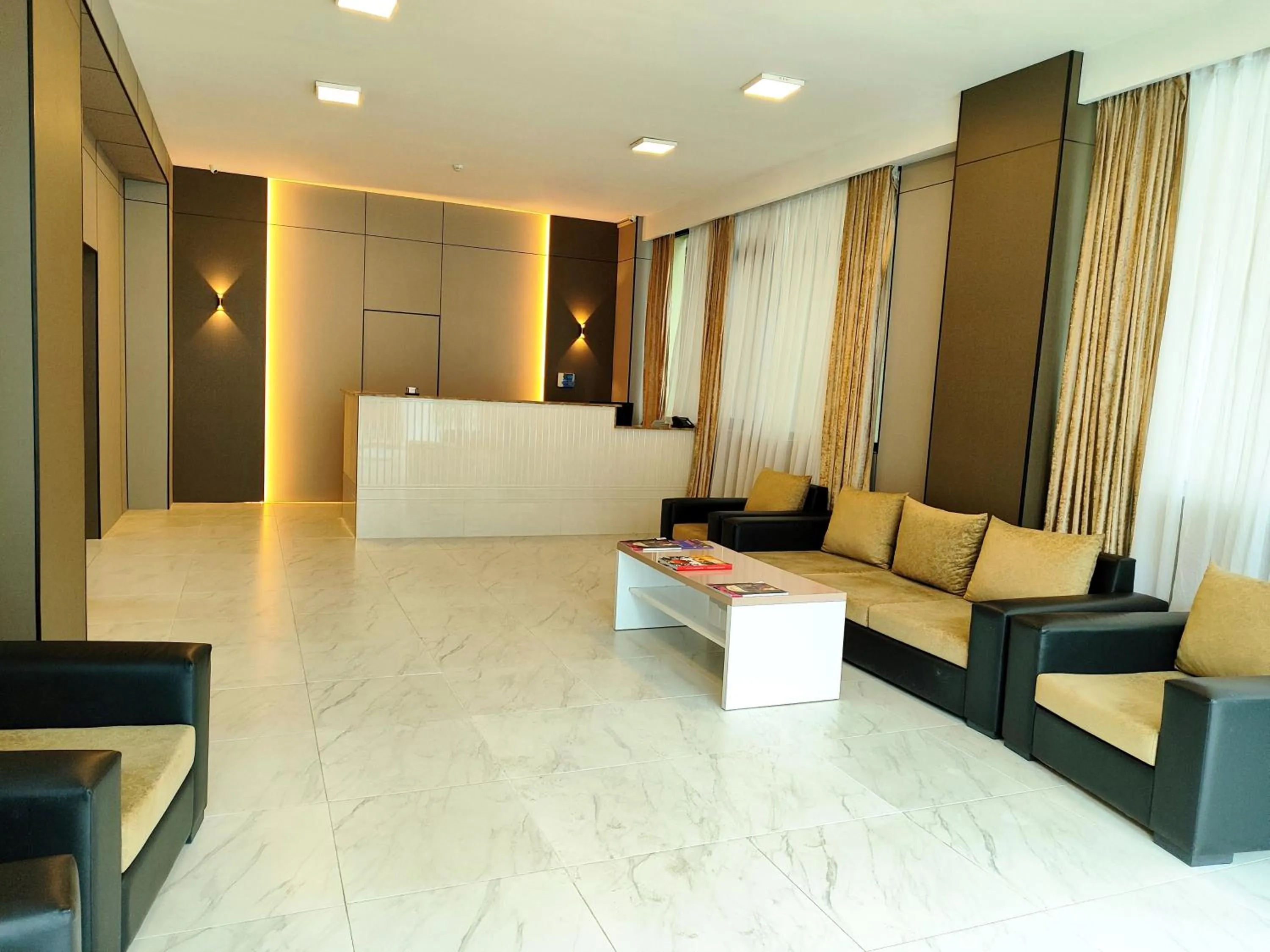 Lobby or reception in Diplomat Suites Hotel