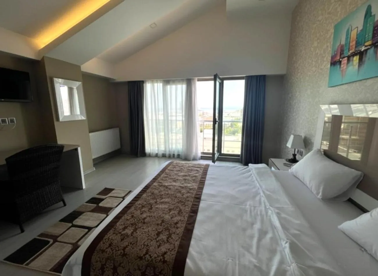 Bed in Diplomat Suites Hotel