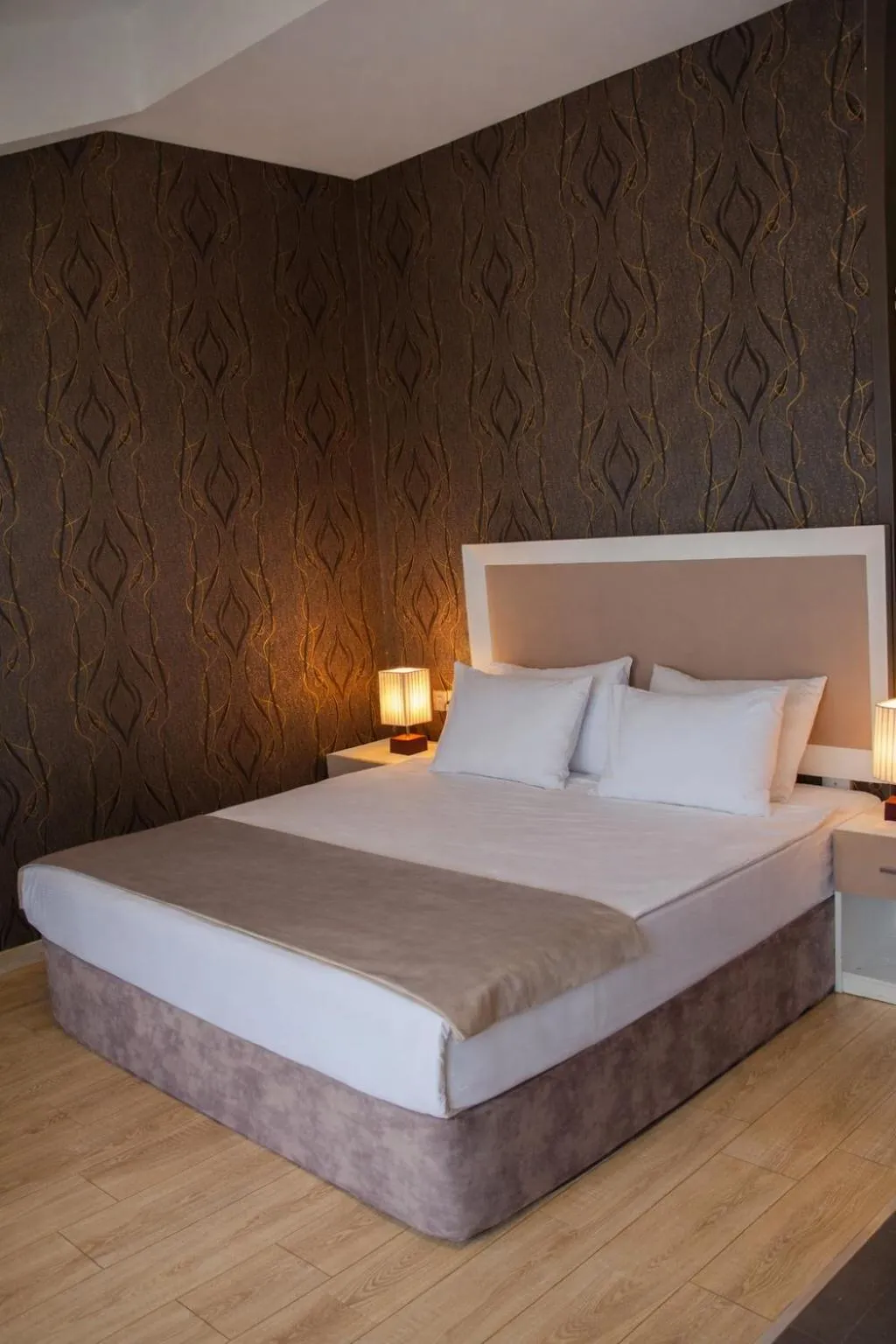 Bed in Diplomat Suites Hotel