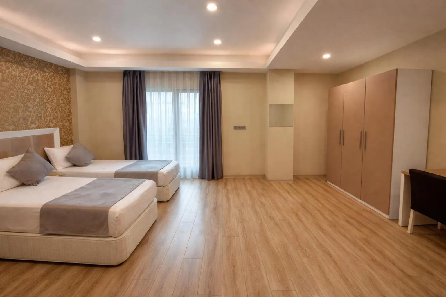 Bed in Diplomat Suites Hotel