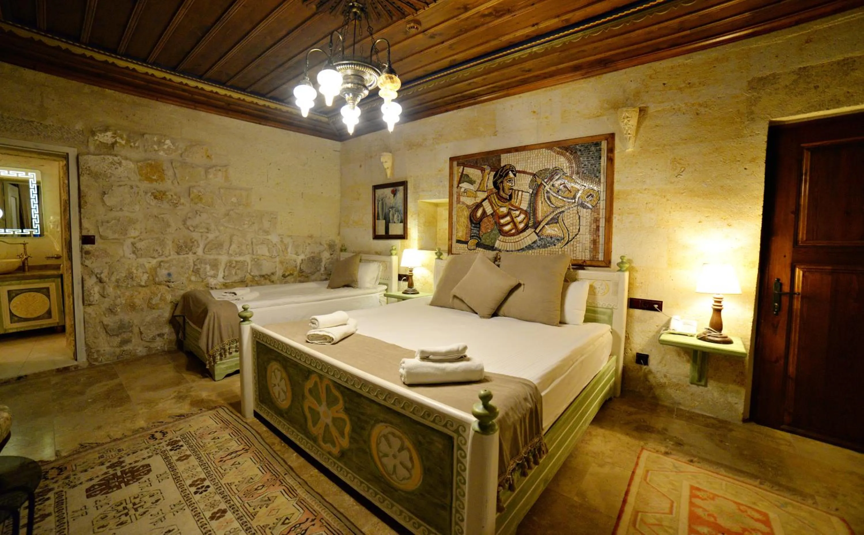 Bedroom, Bed in Caftan Cave Suites