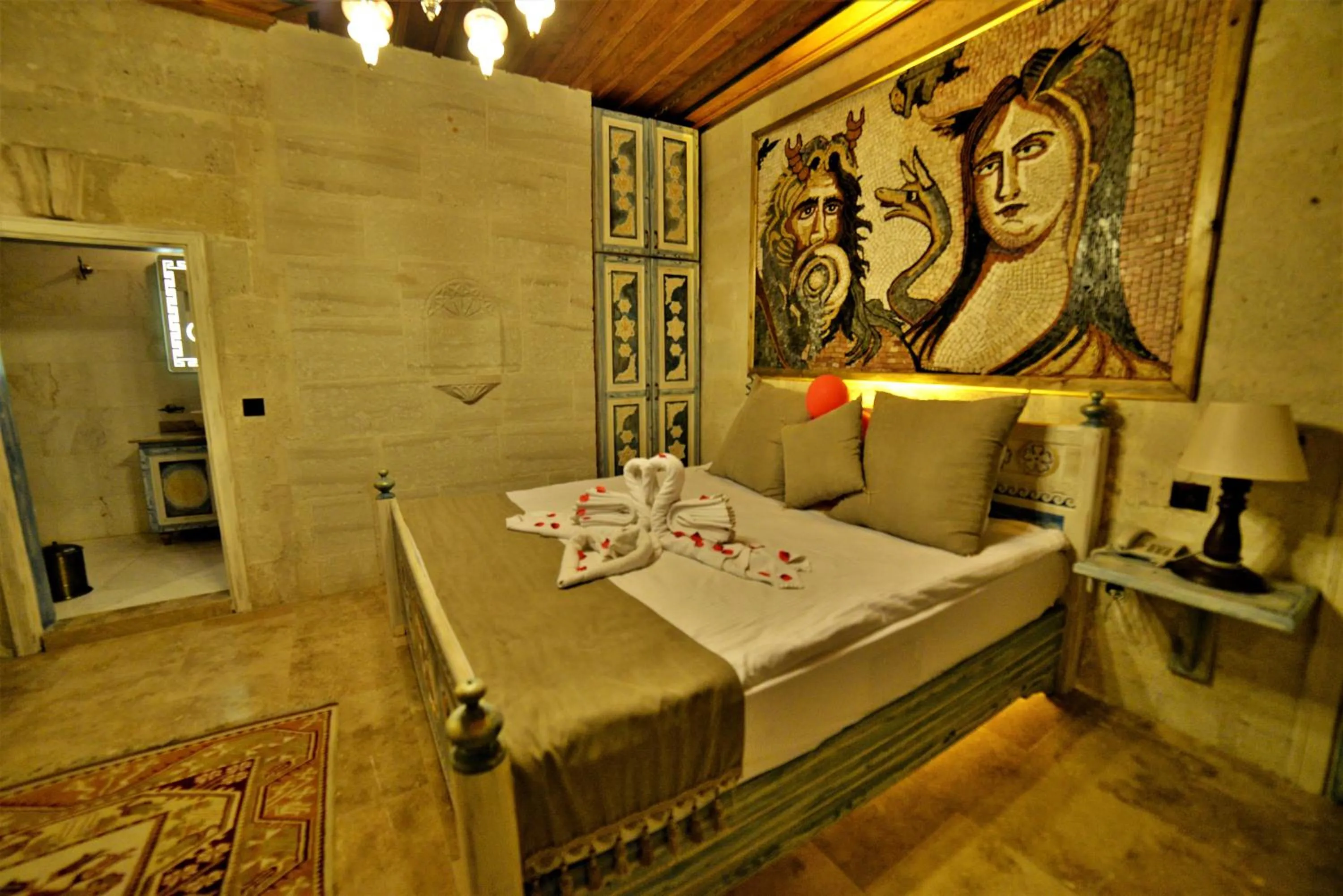Bedroom, Bed in Caftan Cave Suites
