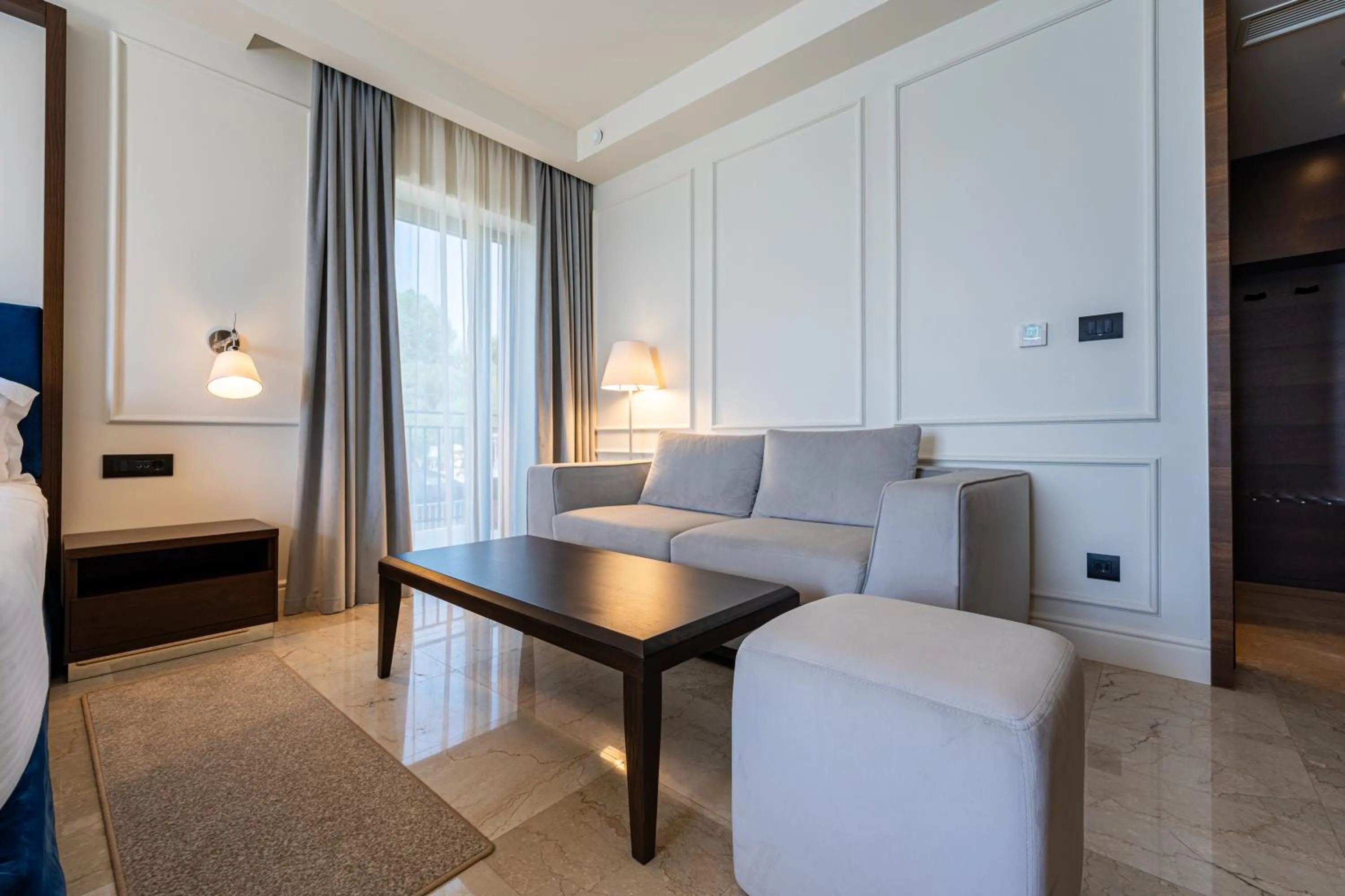 Seating area, Bed in Hotel California by Aycon