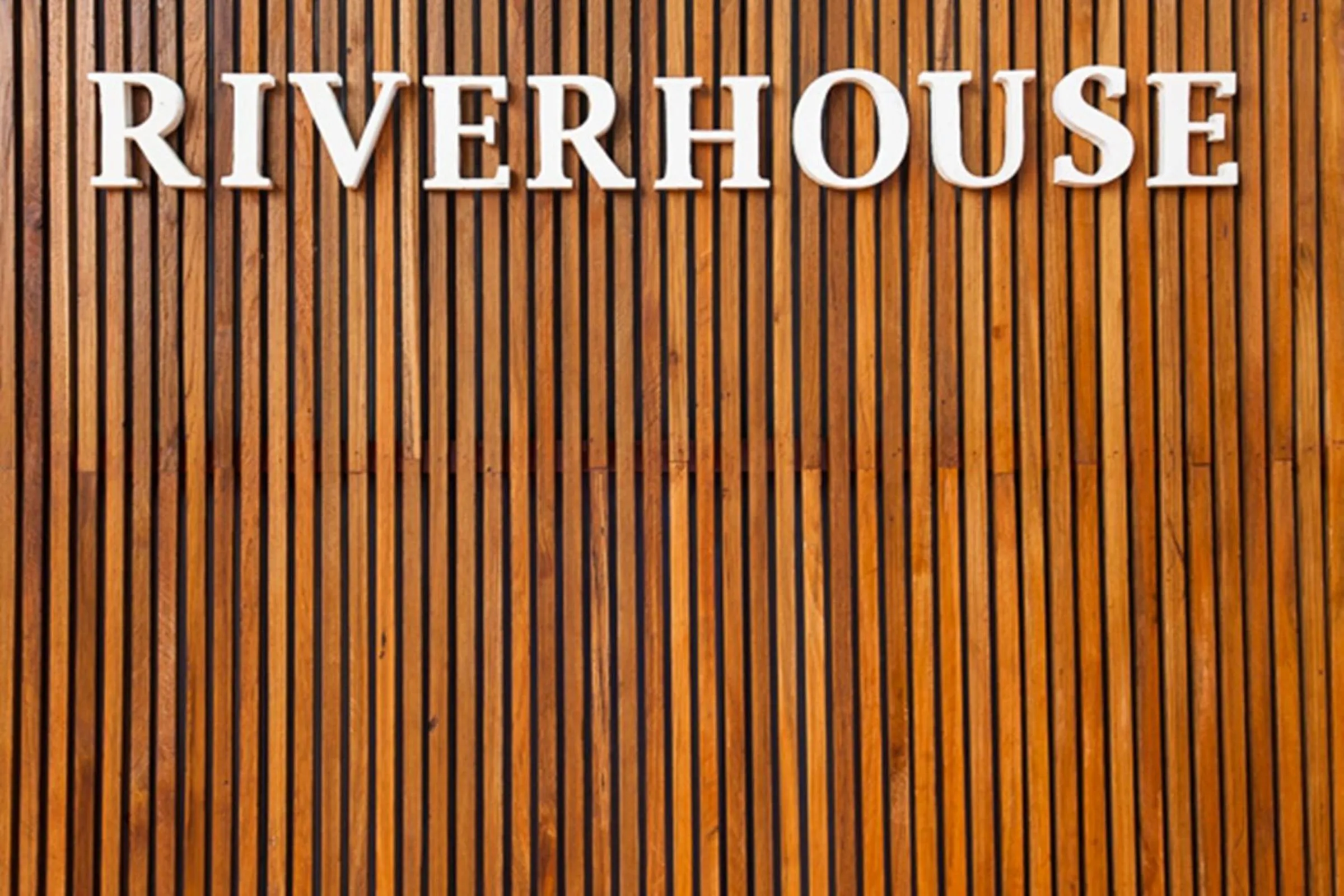 Property logo or sign in Riverhouse-The Teak House