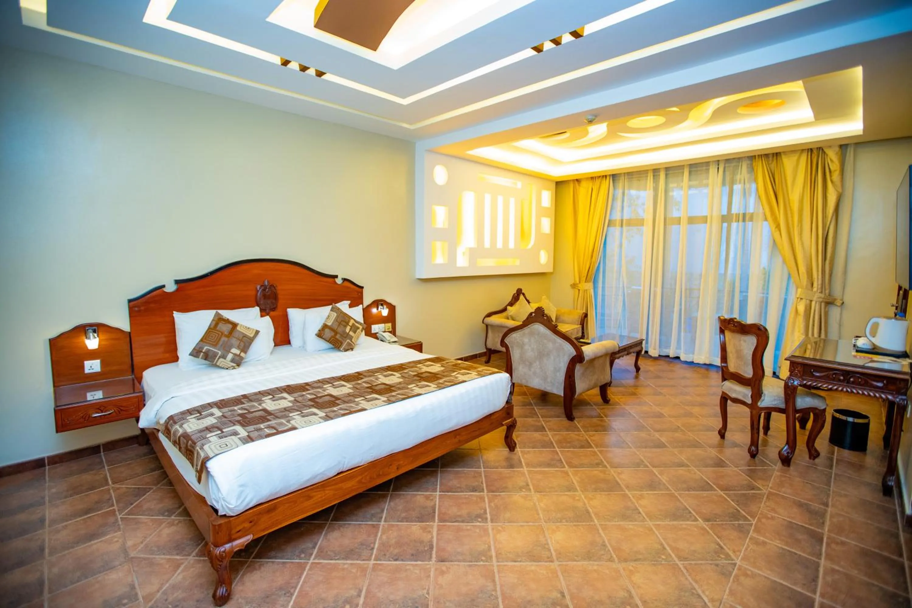 Bed in Malaika Beach Resort