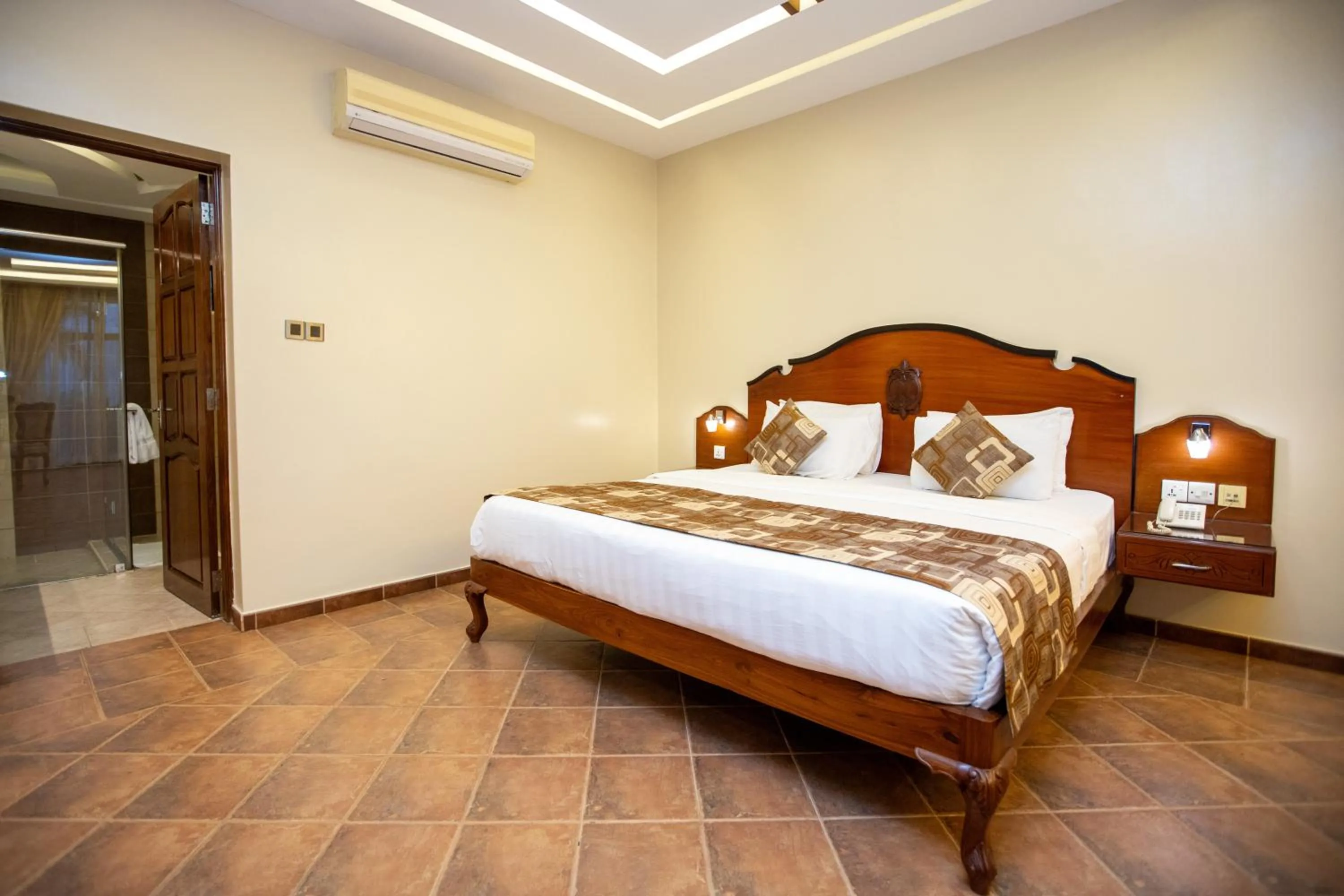 Bed in Malaika Beach Resort