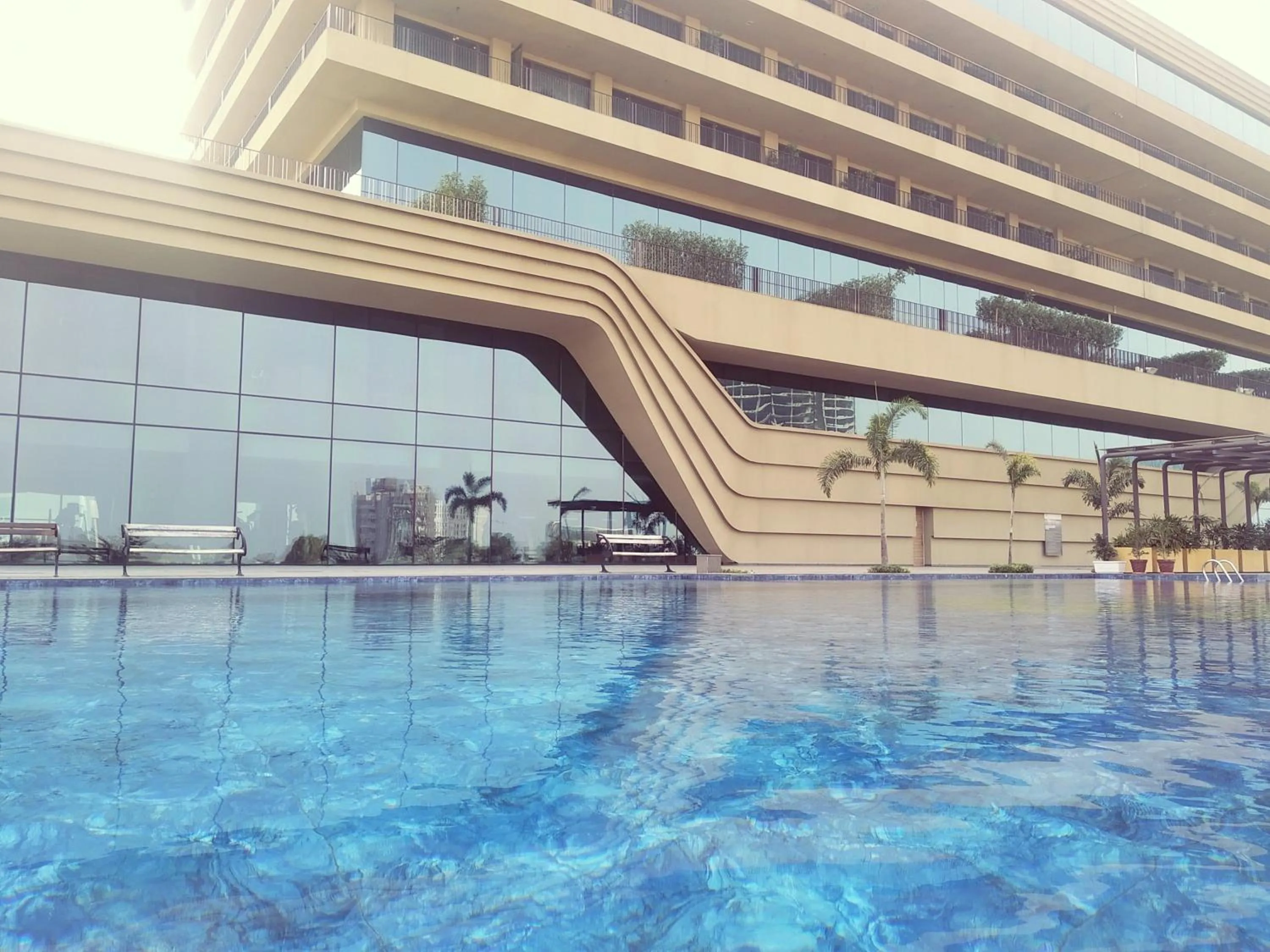 Swimming pool in Gift City Club, a member of Radisson Individuals