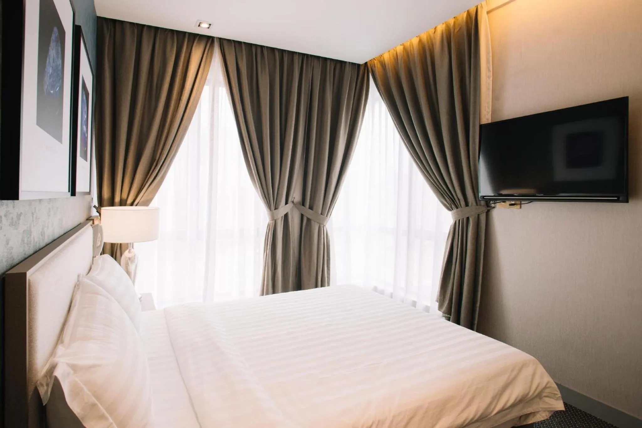 Bed in De Cyber Boutique Hotel