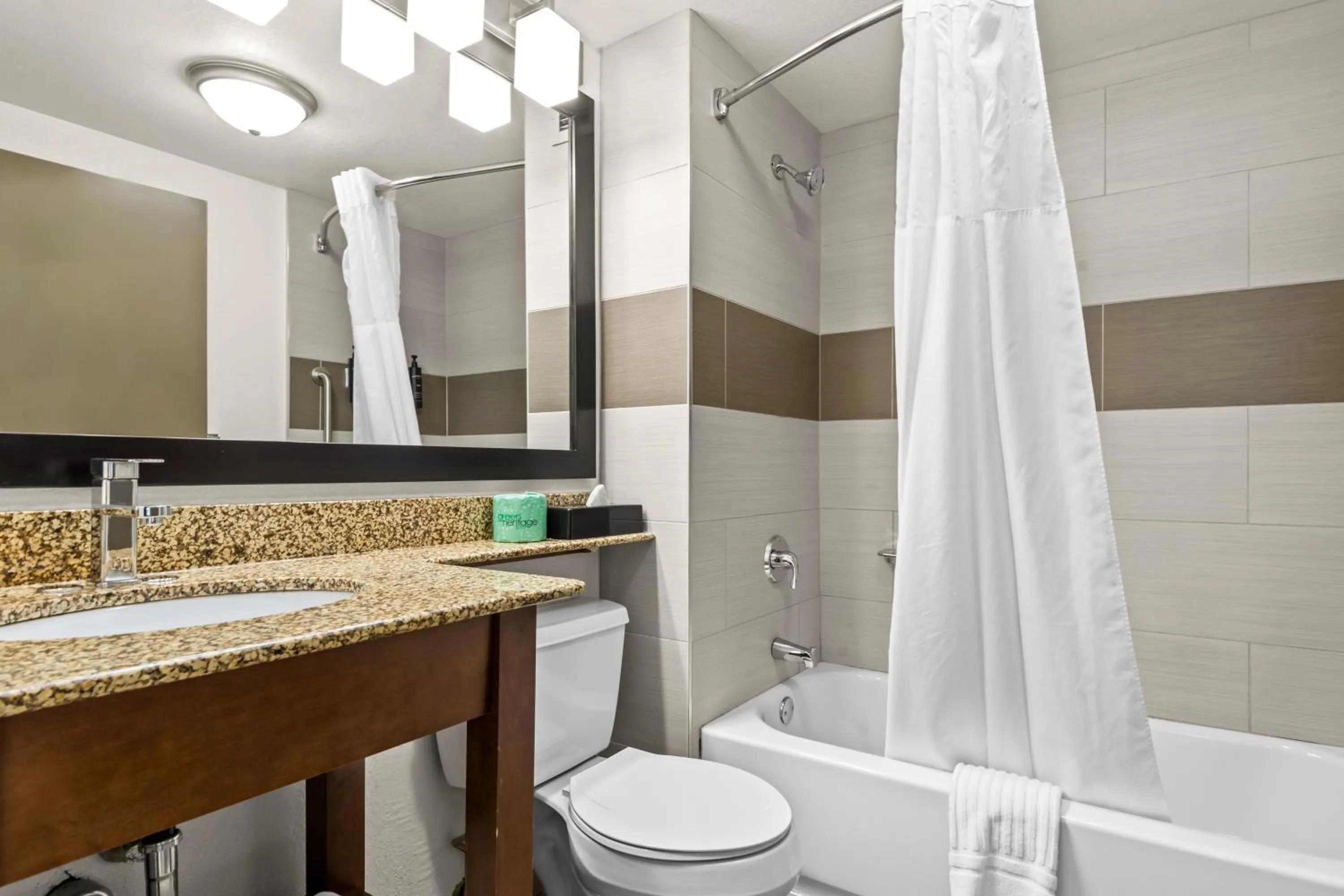 Shower in Hotel Concord Syracuse, an Ascend Collection Hotel