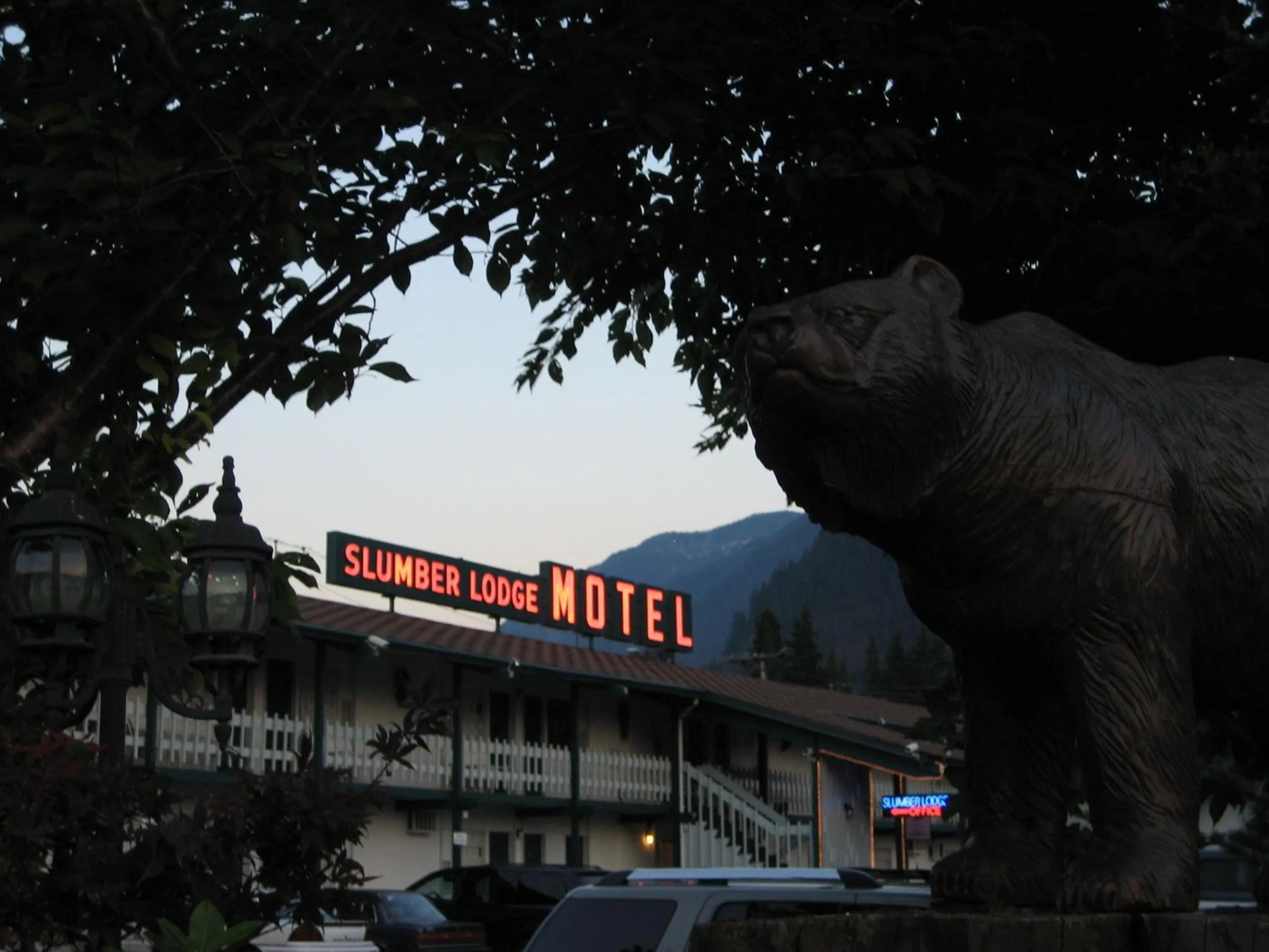 Property logo or sign in Slumber Lodge