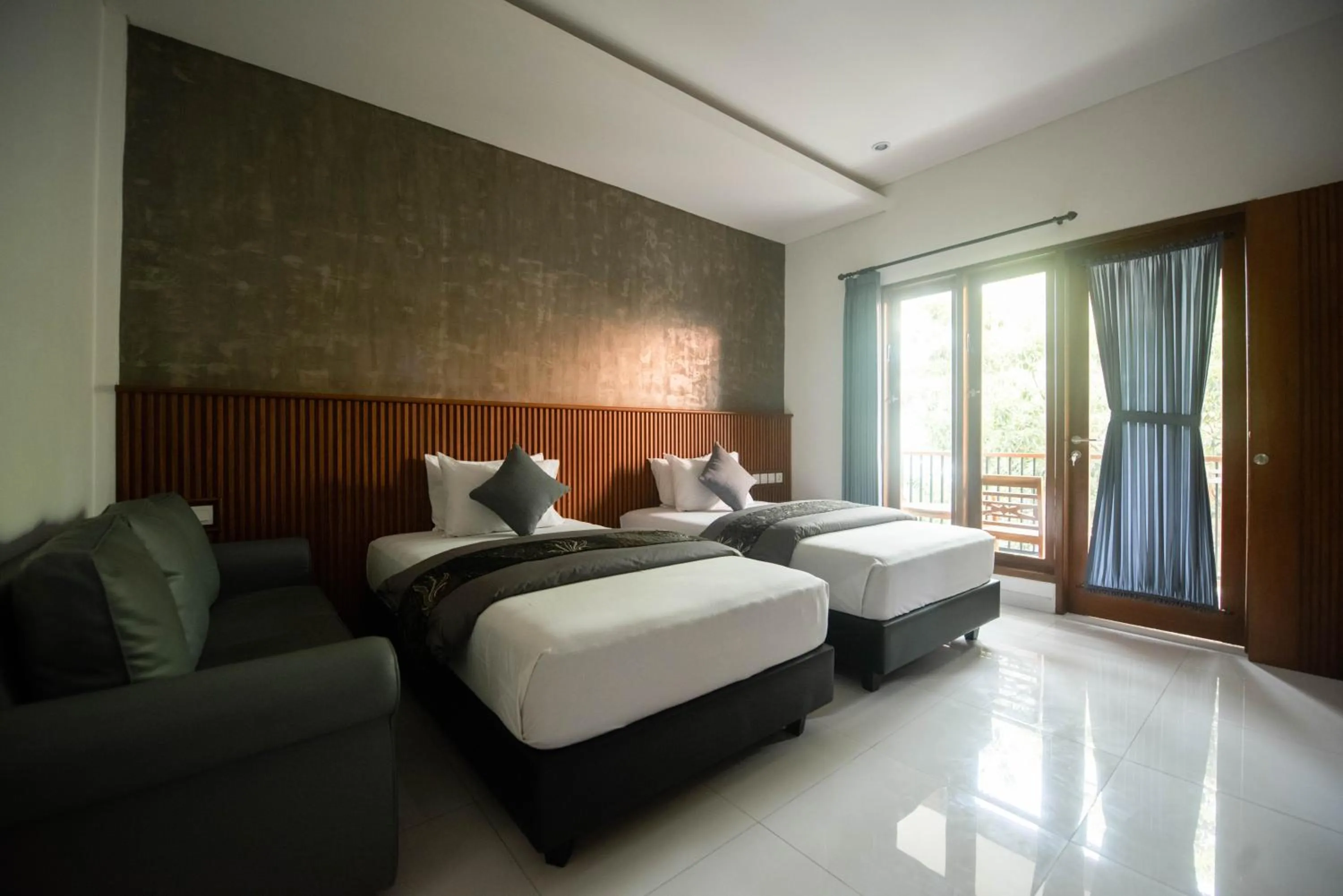 Bed in Sandat Hotel Legian