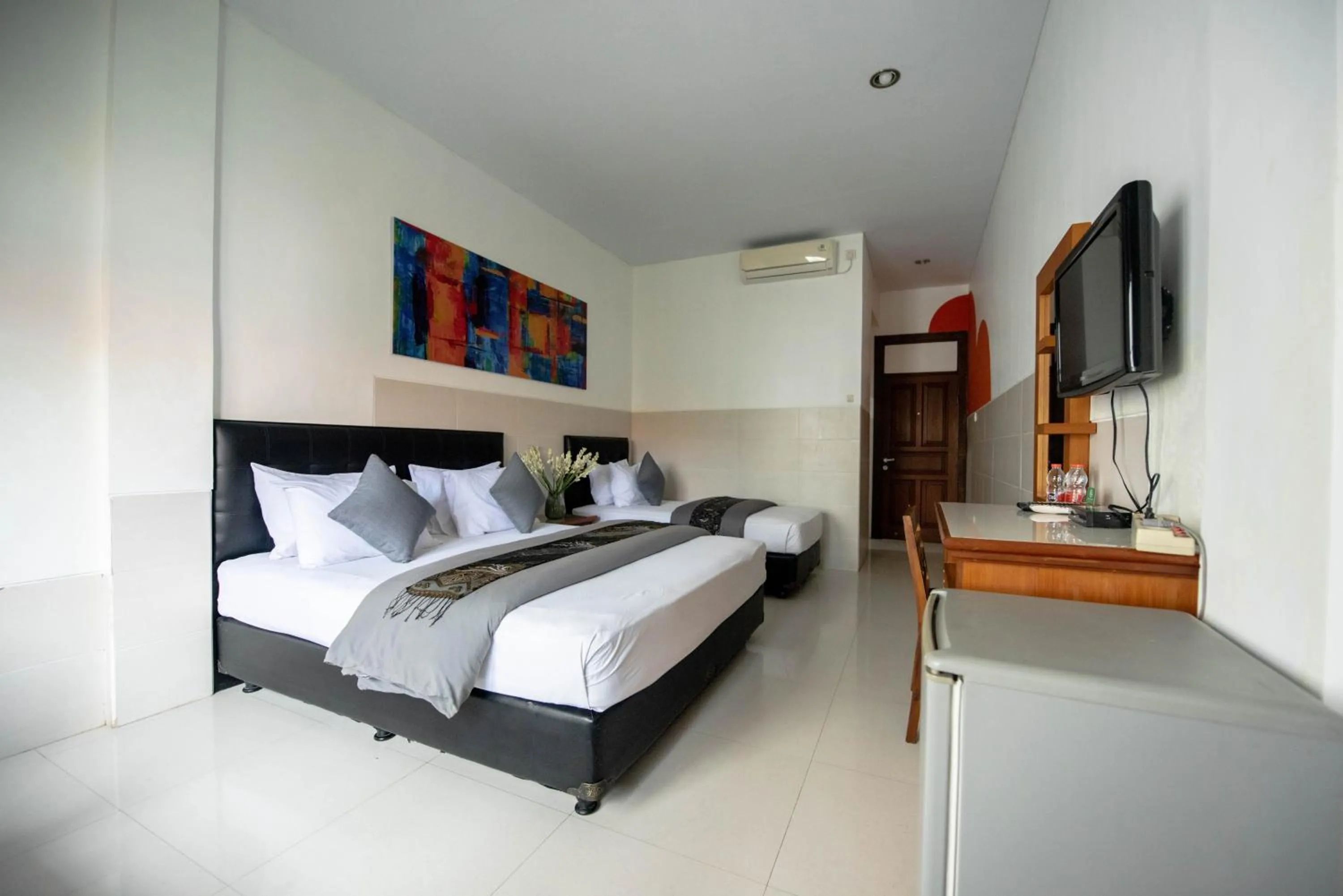 Bed in Sandat Hotel Legian