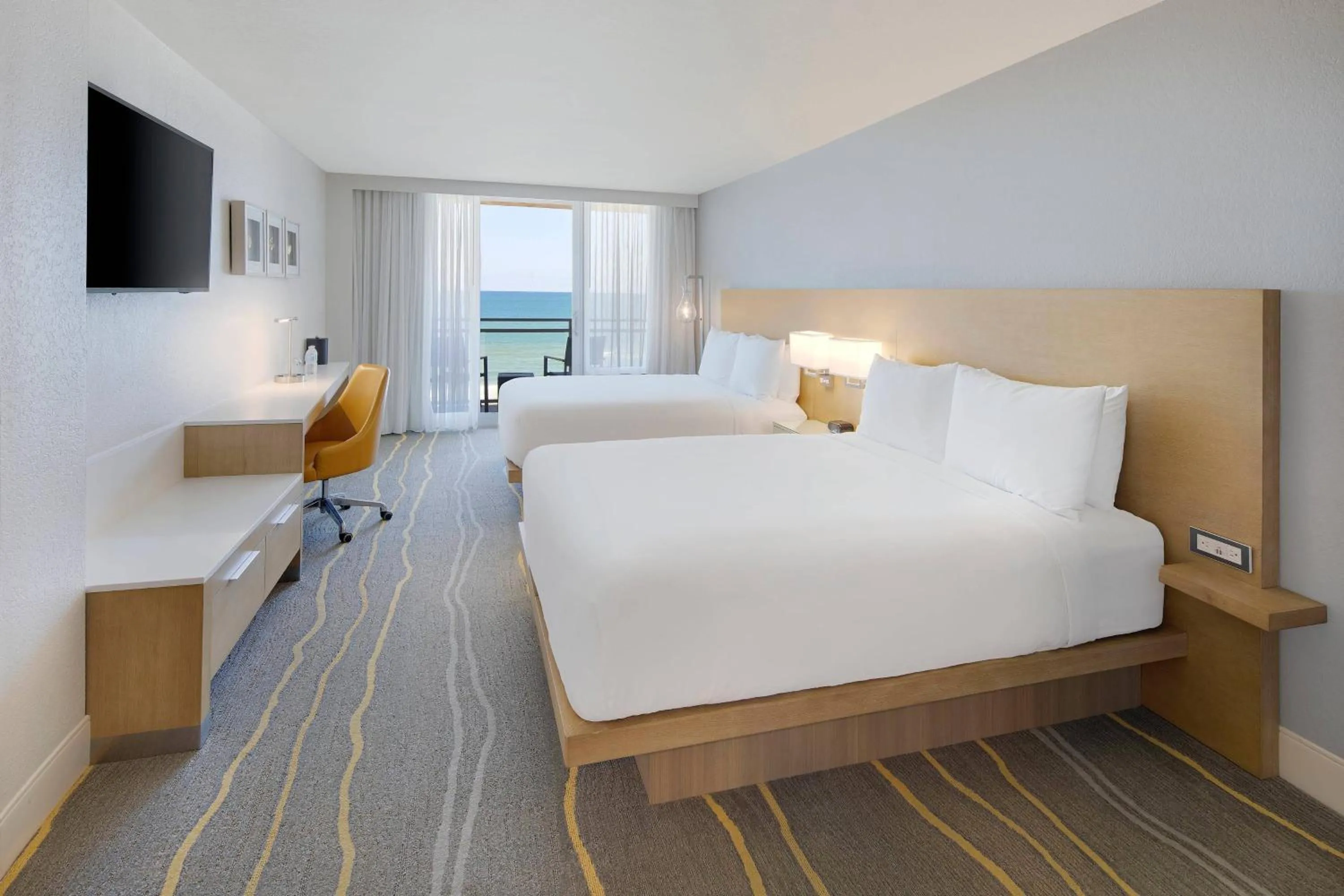 Photo of the whole room, Bed in Delta Hotels by Marriott Daytona Beach Oceanfront