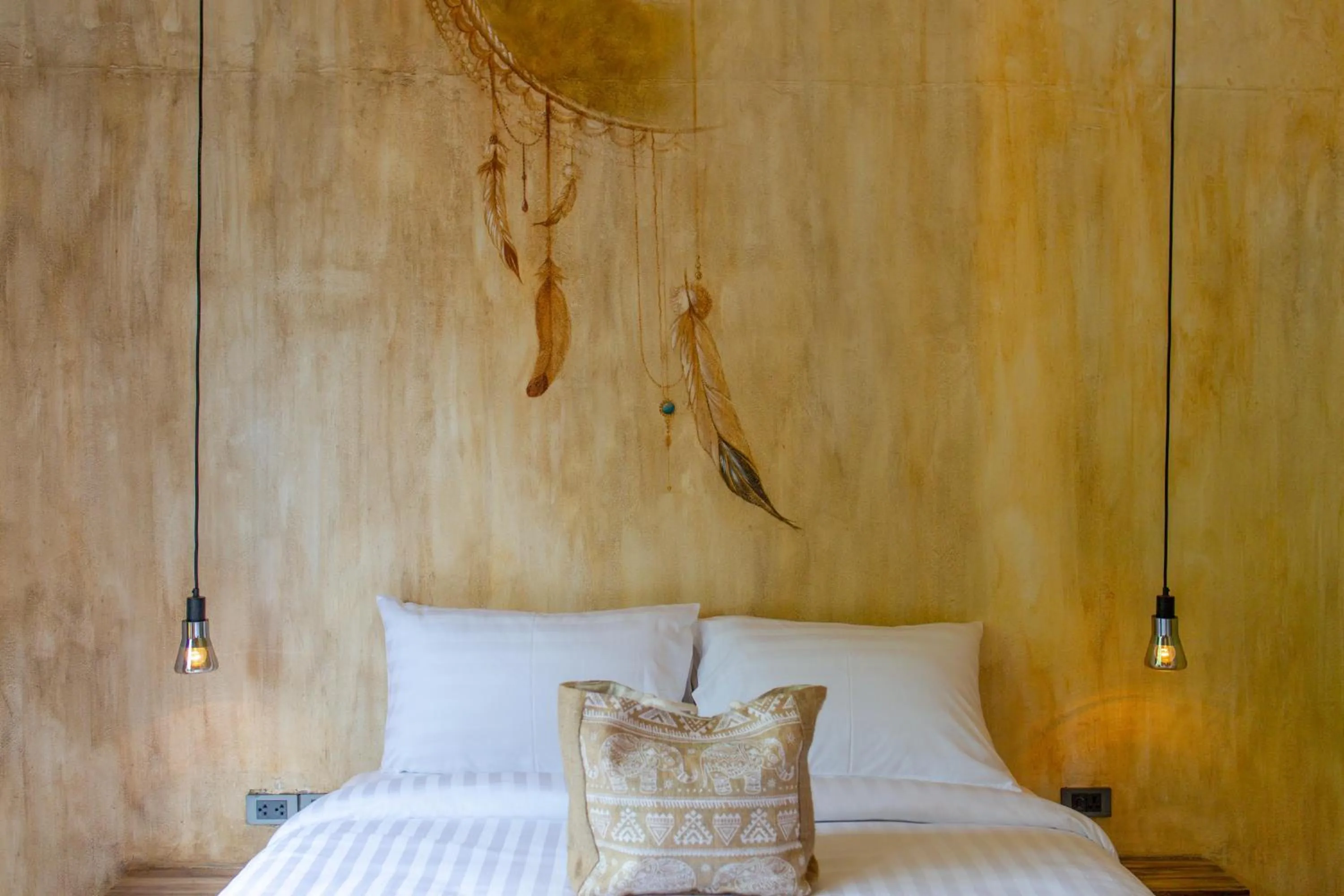 Bed in Dreamcatcher Boutique Hotel