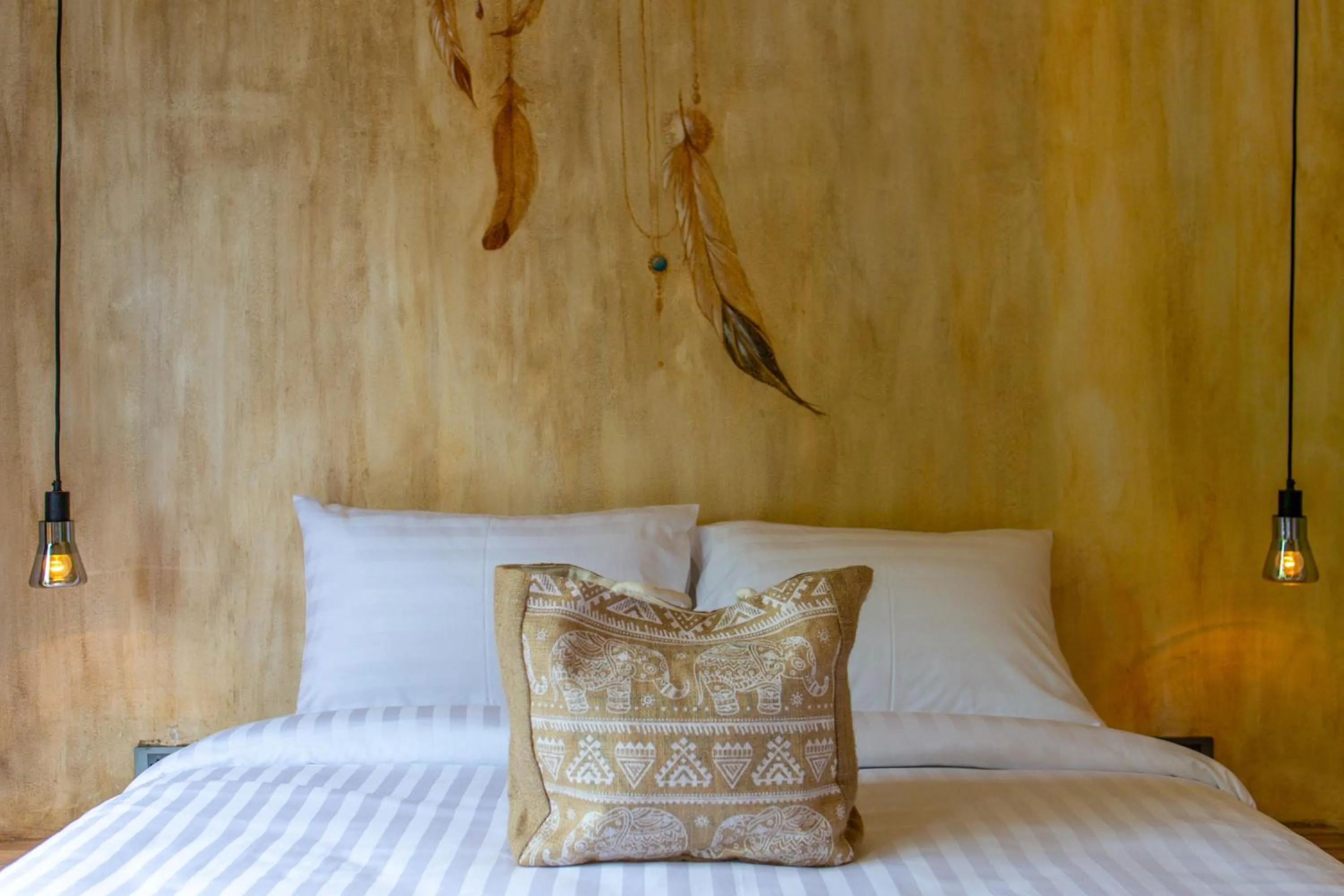 Bed in Dreamcatcher Boutique Hotel