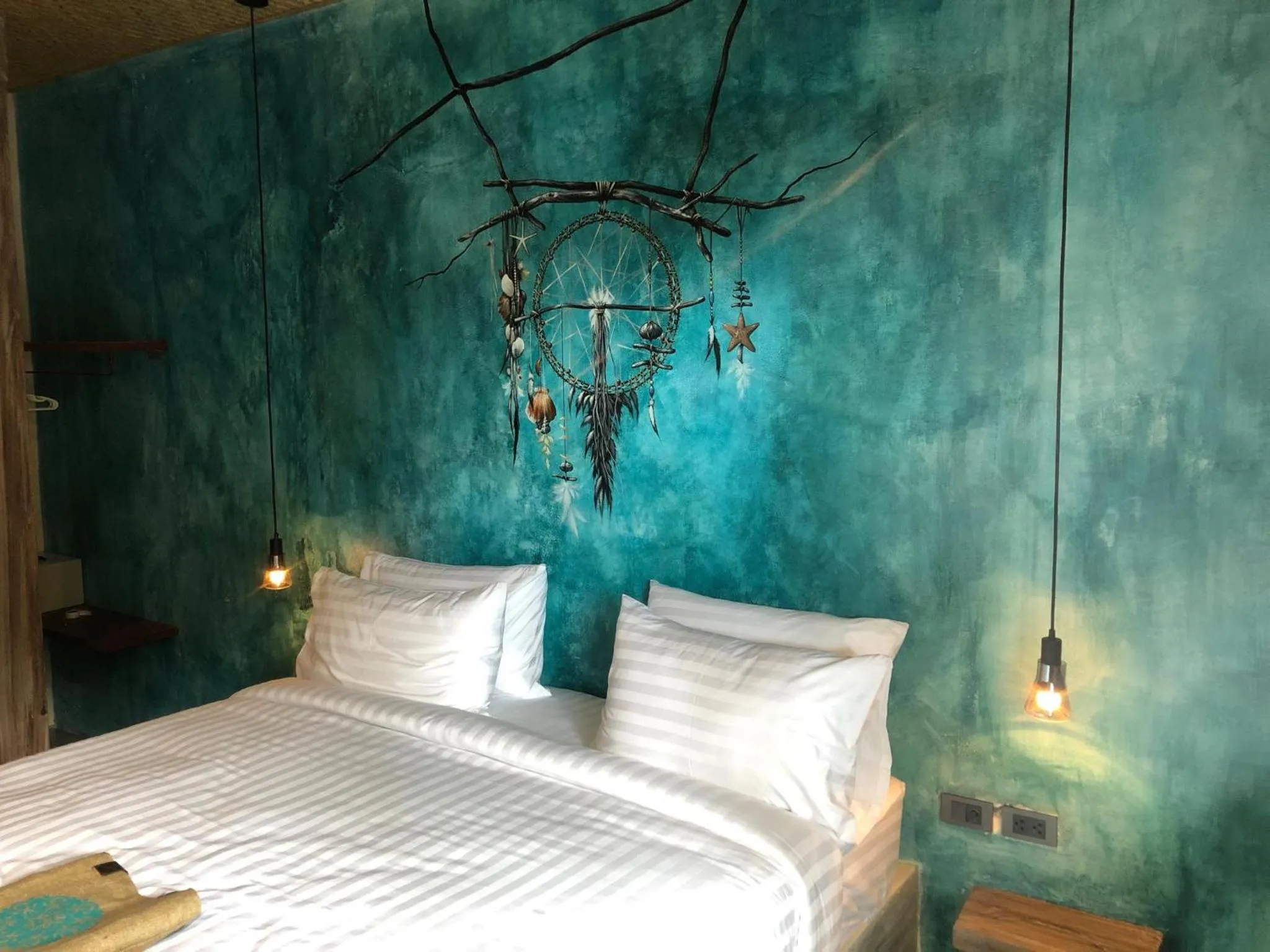 Bed in Dreamcatcher Boutique Hotel