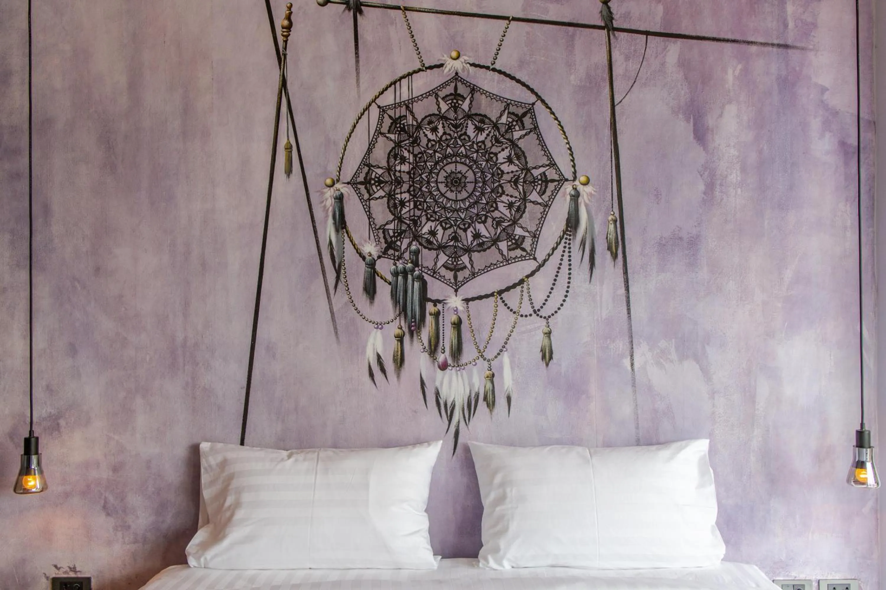 Bed in Dreamcatcher Boutique Hotel