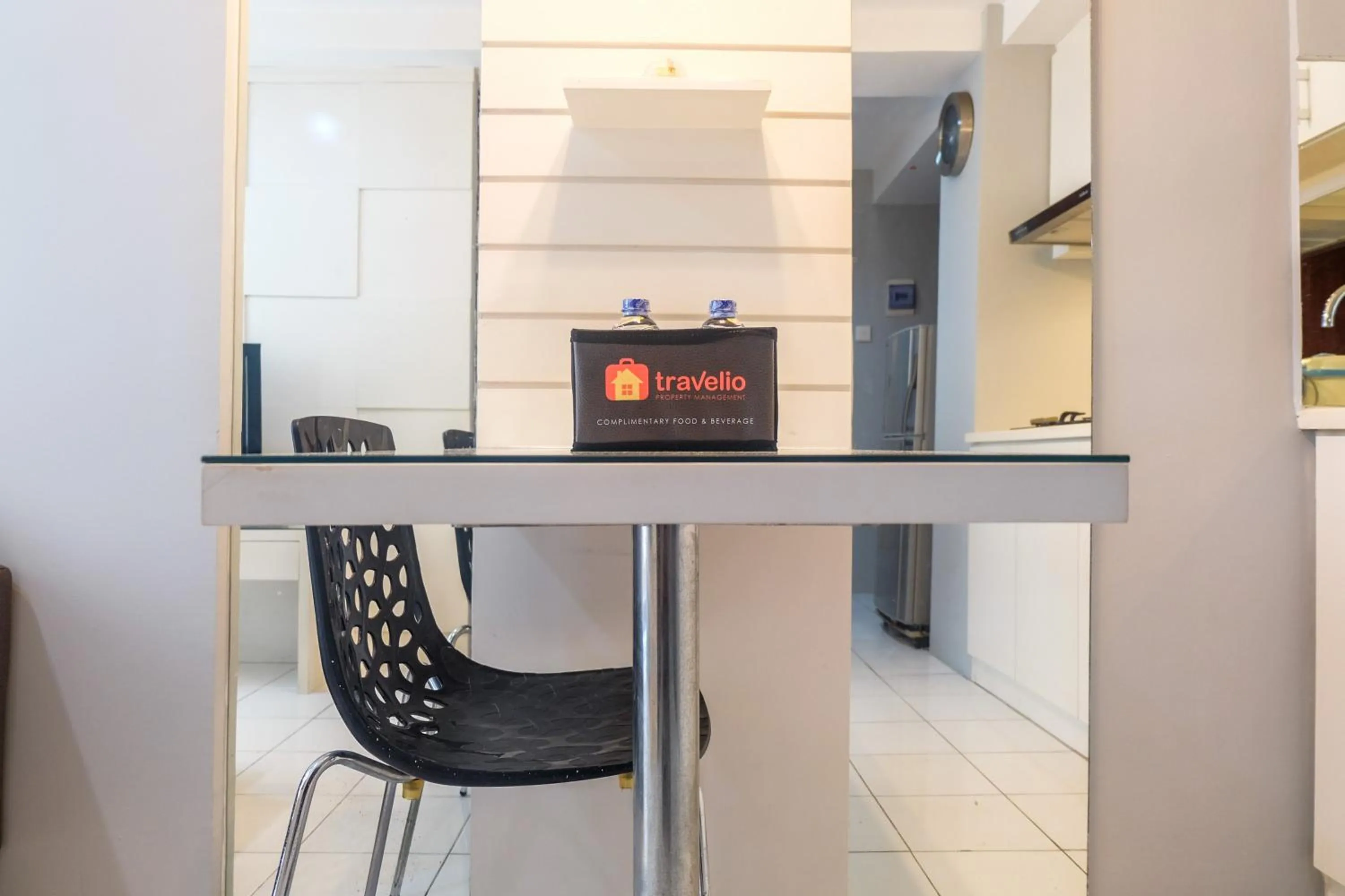 Dining area in Best Price and Minimalist 2BR Kebagusan City Apartment By Travelio