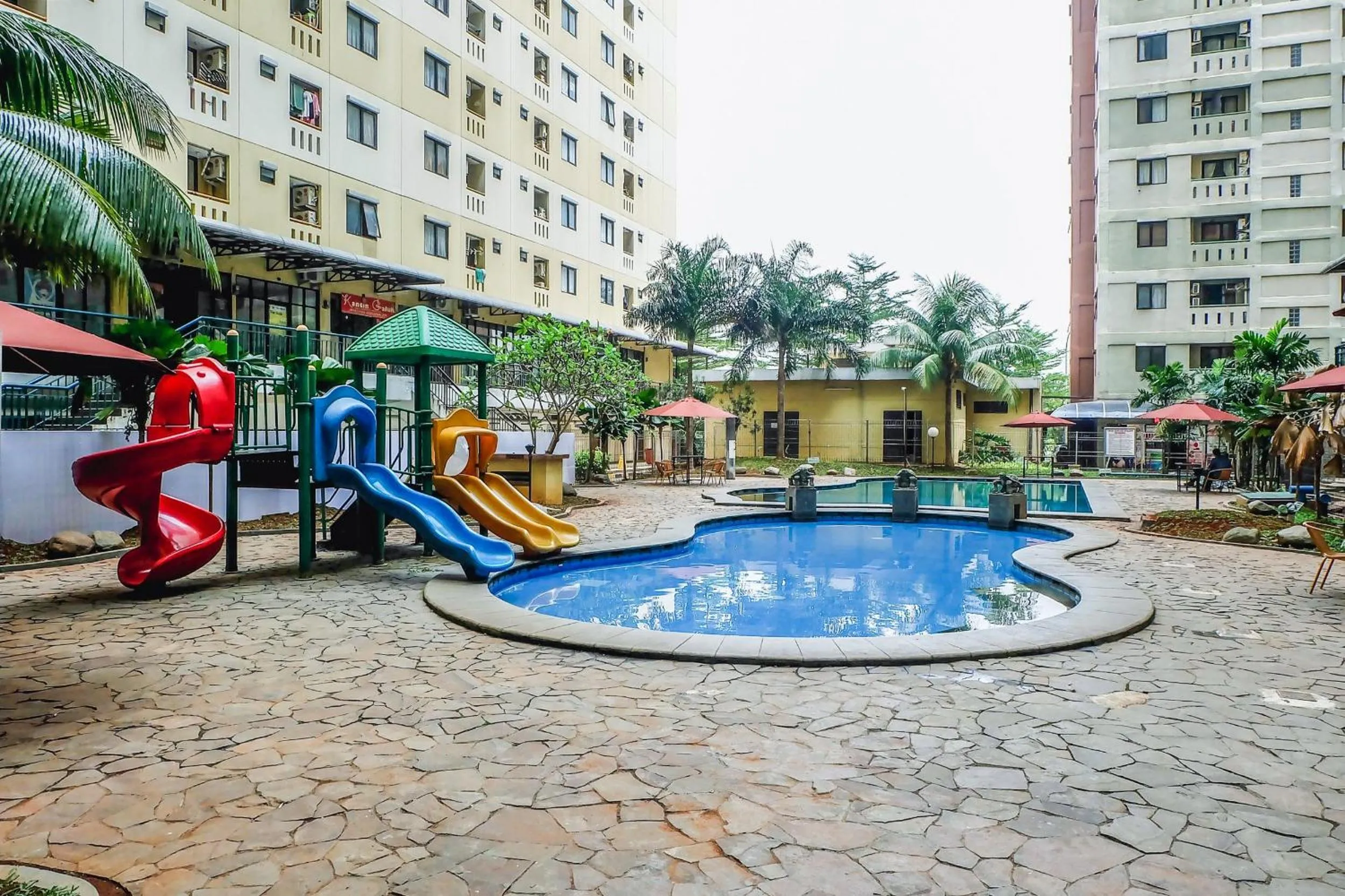 Children play ground in Best Price and Minimalist 2BR Kebagusan City Apartment By Travelio