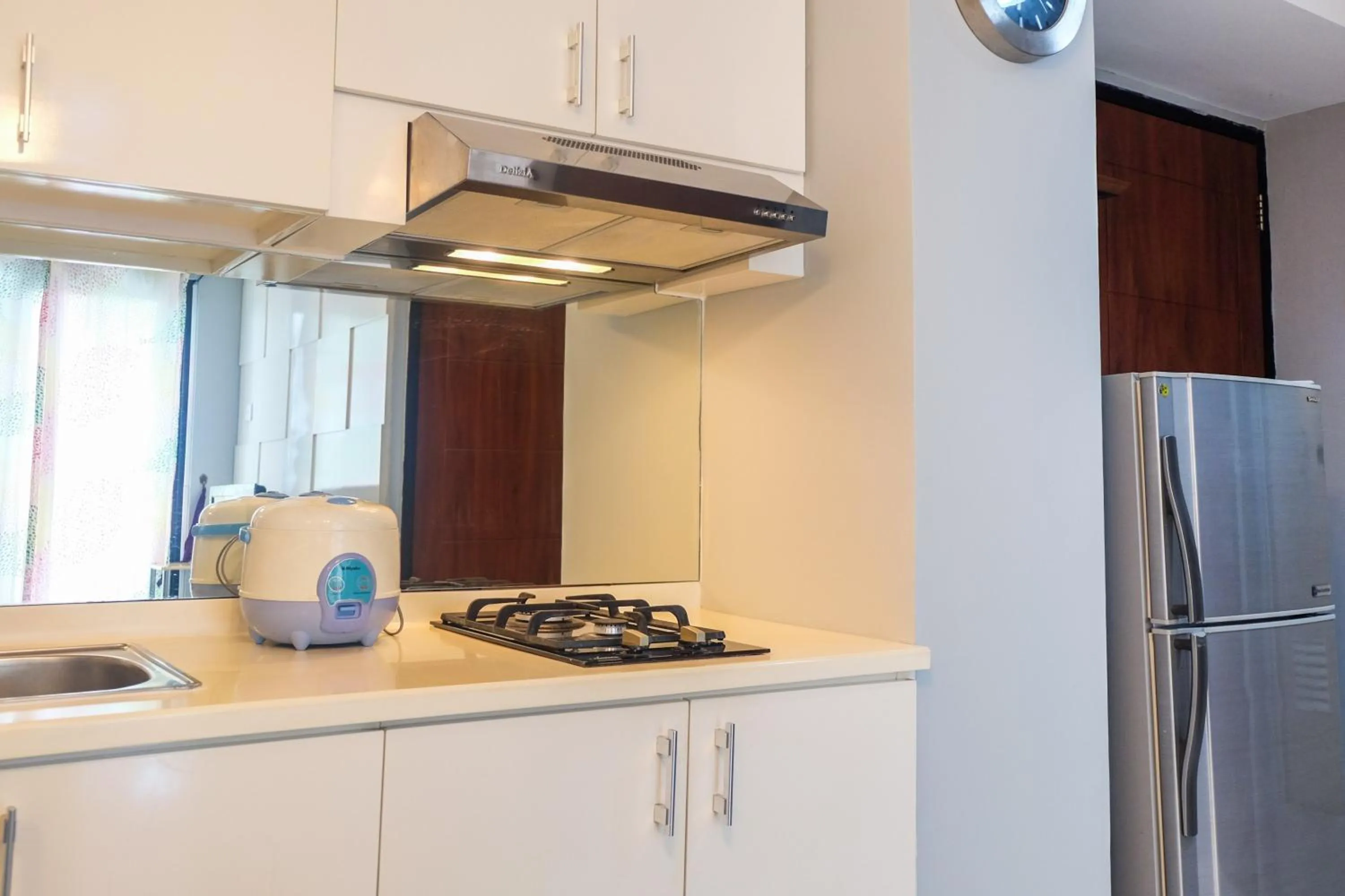 Kitchen or kitchenette in Best Price and Minimalist 2BR Kebagusan City Apartment By Travelio