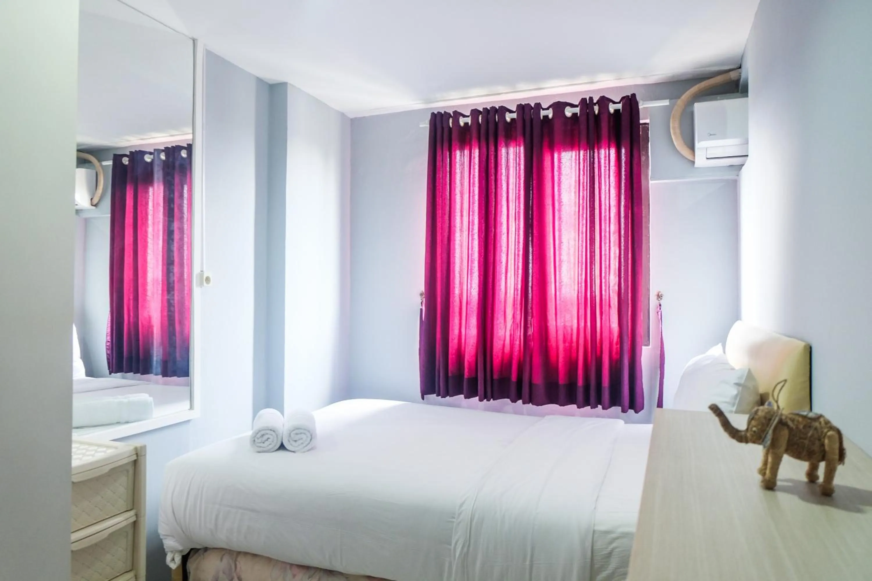 Bed in Best Price and Minimalist 2BR Kebagusan City Apartment By Travelio