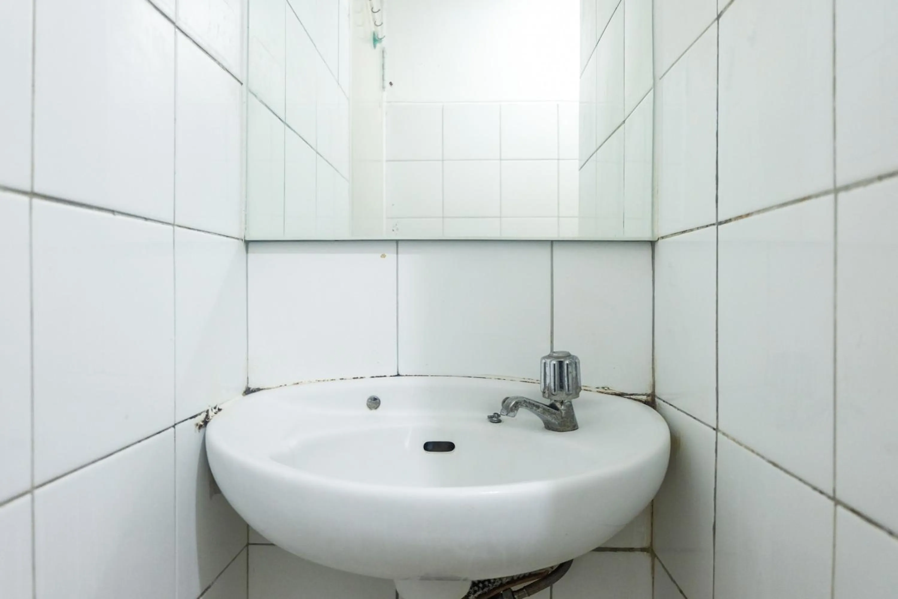 Bathroom in Best Price and Minimalist 2BR Kebagusan City Apartment By Travelio