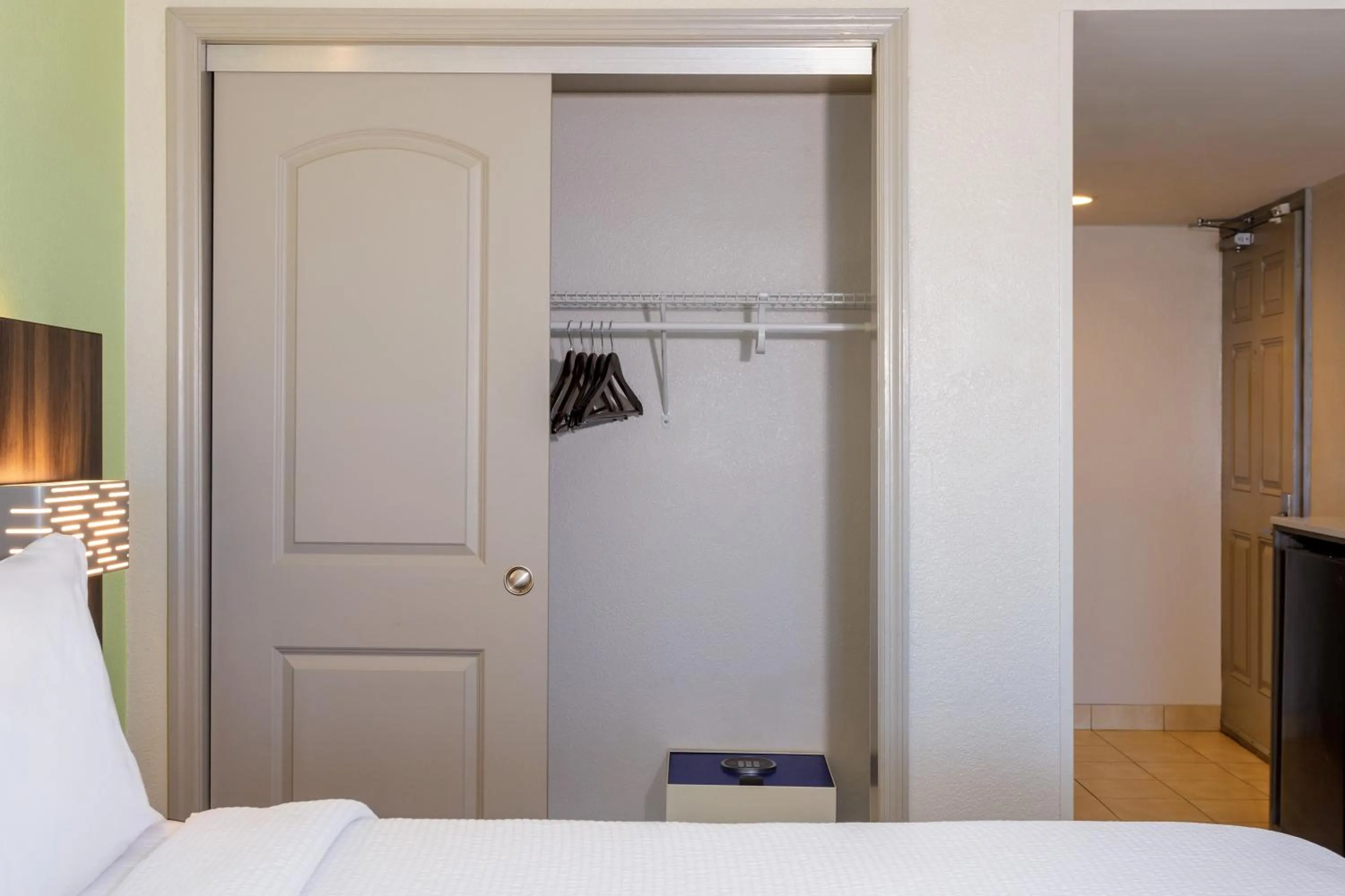 flat iron, Bed in Holiday Inn Express & Suites Oceanfront Daytona Beach Shores by IHG