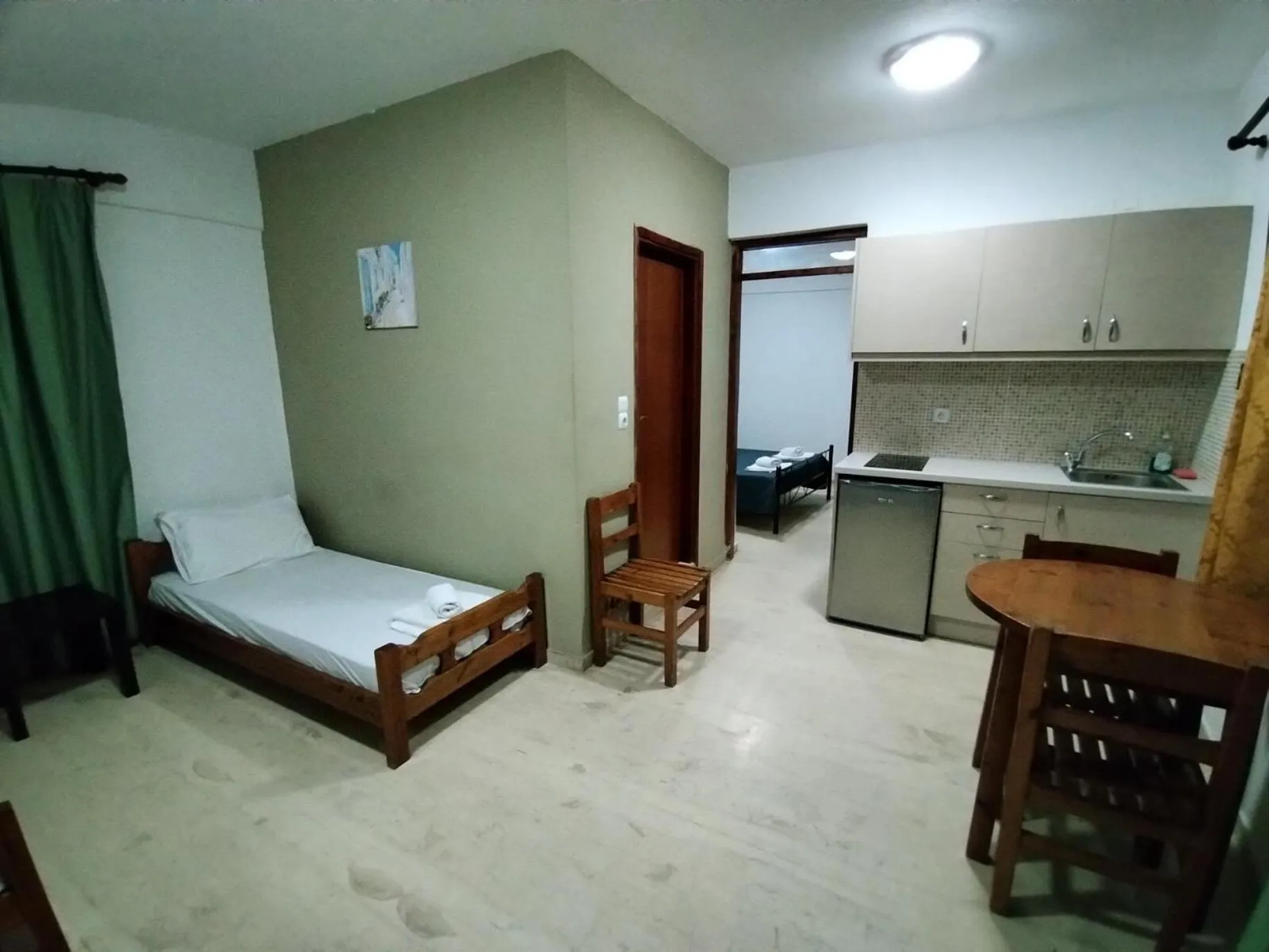 Bed in Koula Apartments