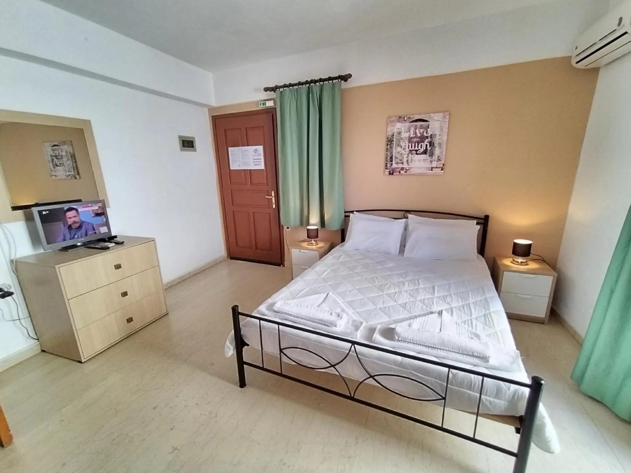 Bed in Koula Apartments