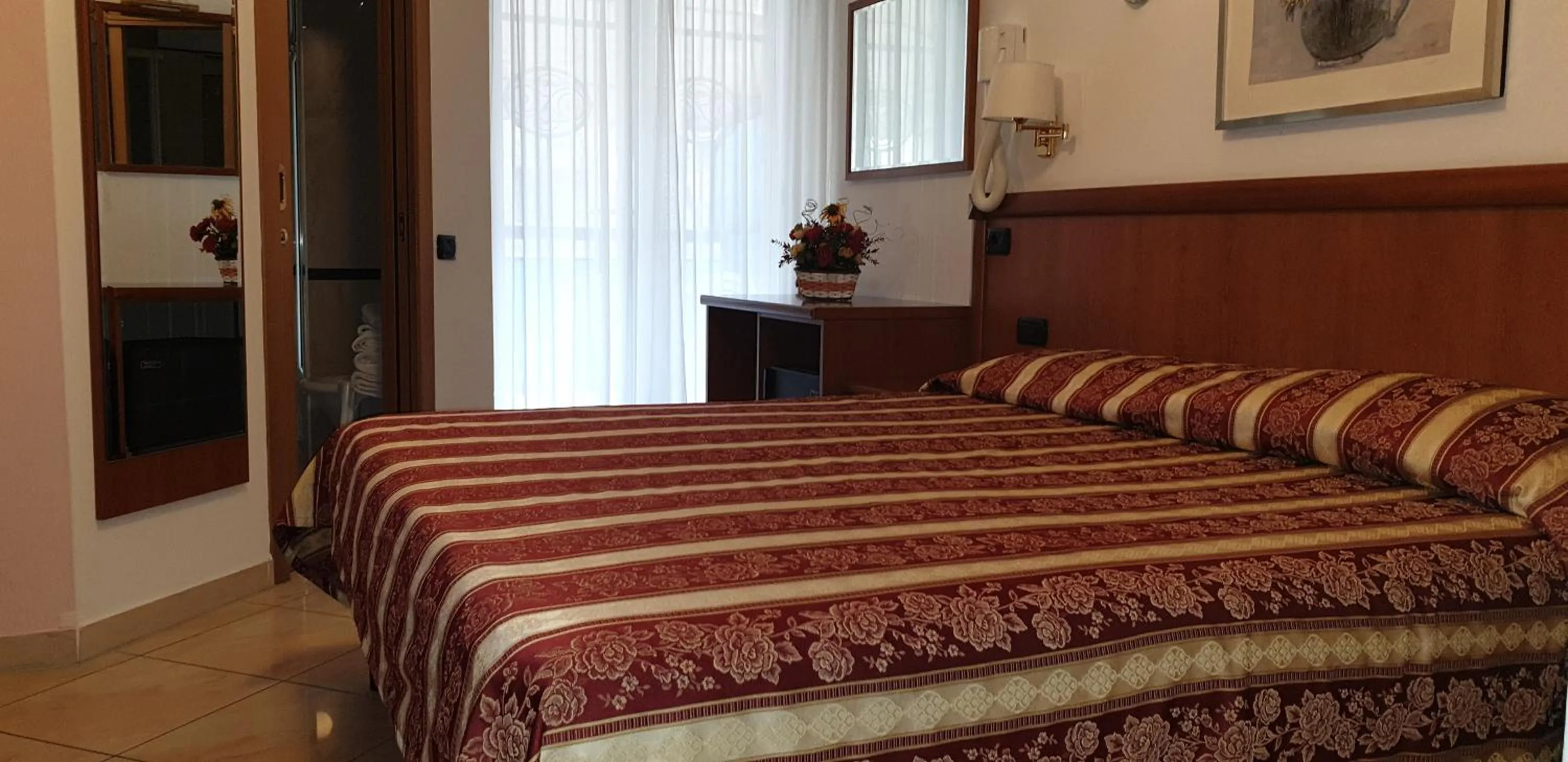 Bed in Hotel Ginevra