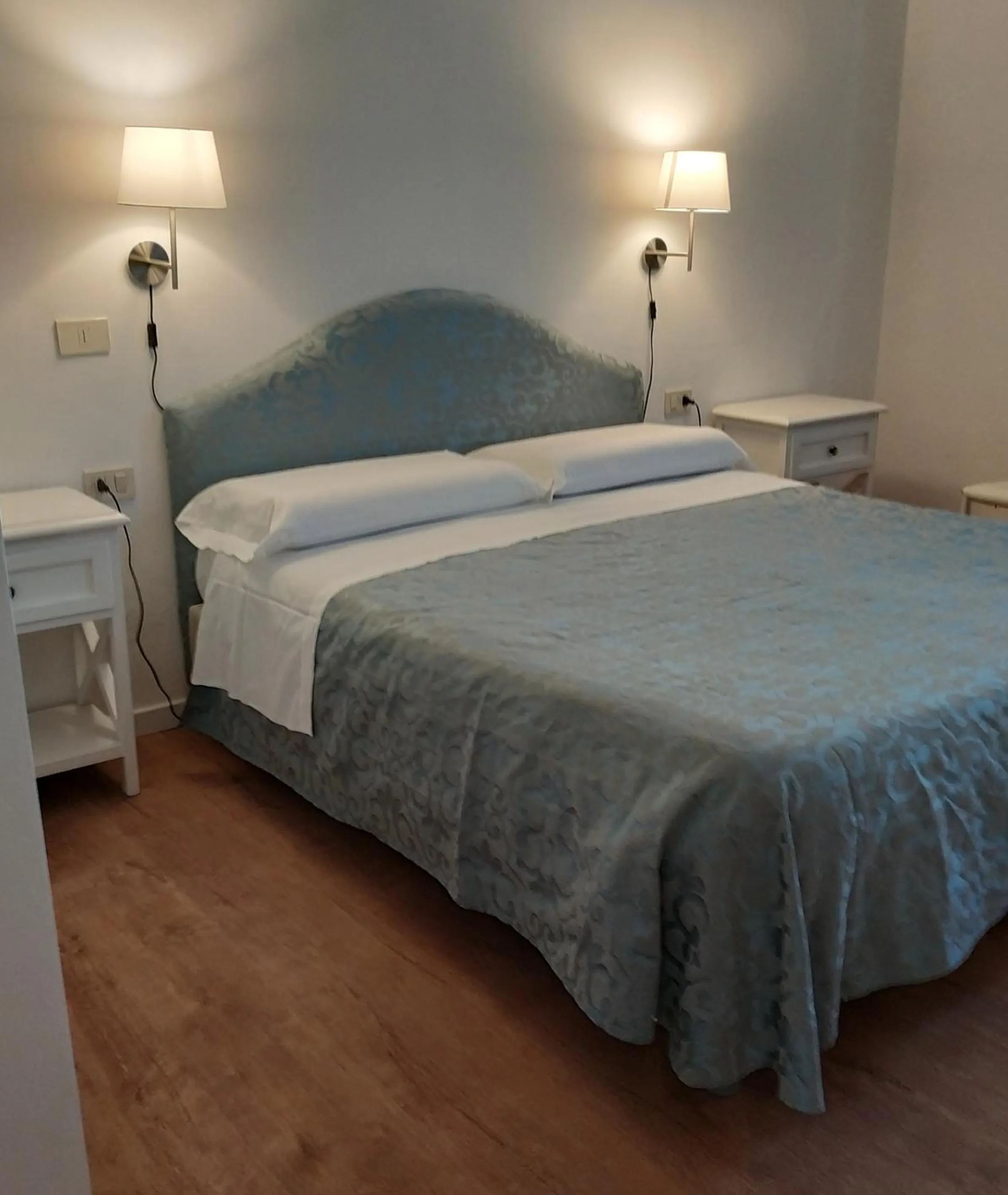 Bed in Il Grifo Camere e Suites