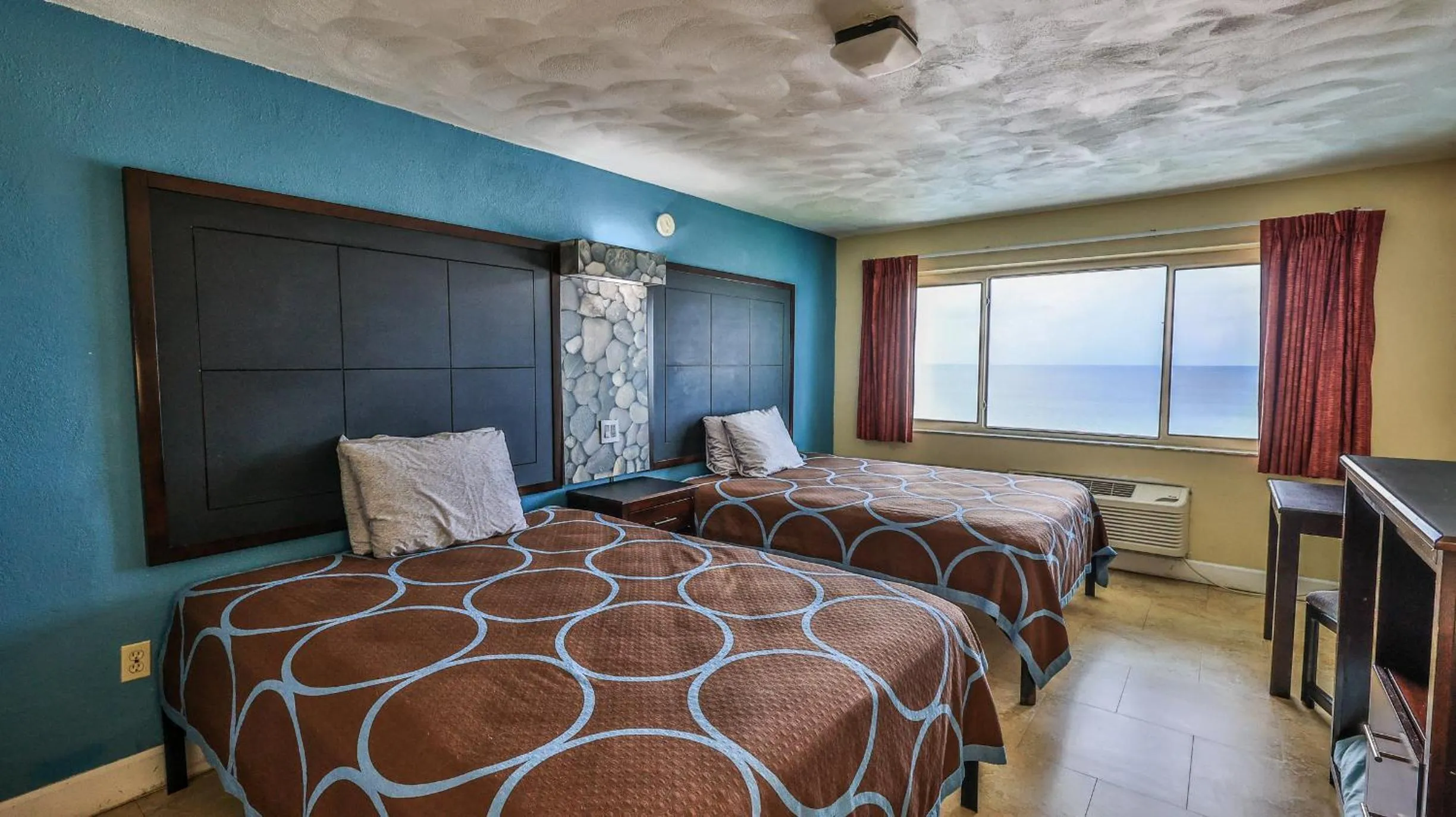 Bed in Driftwood Beach Motel