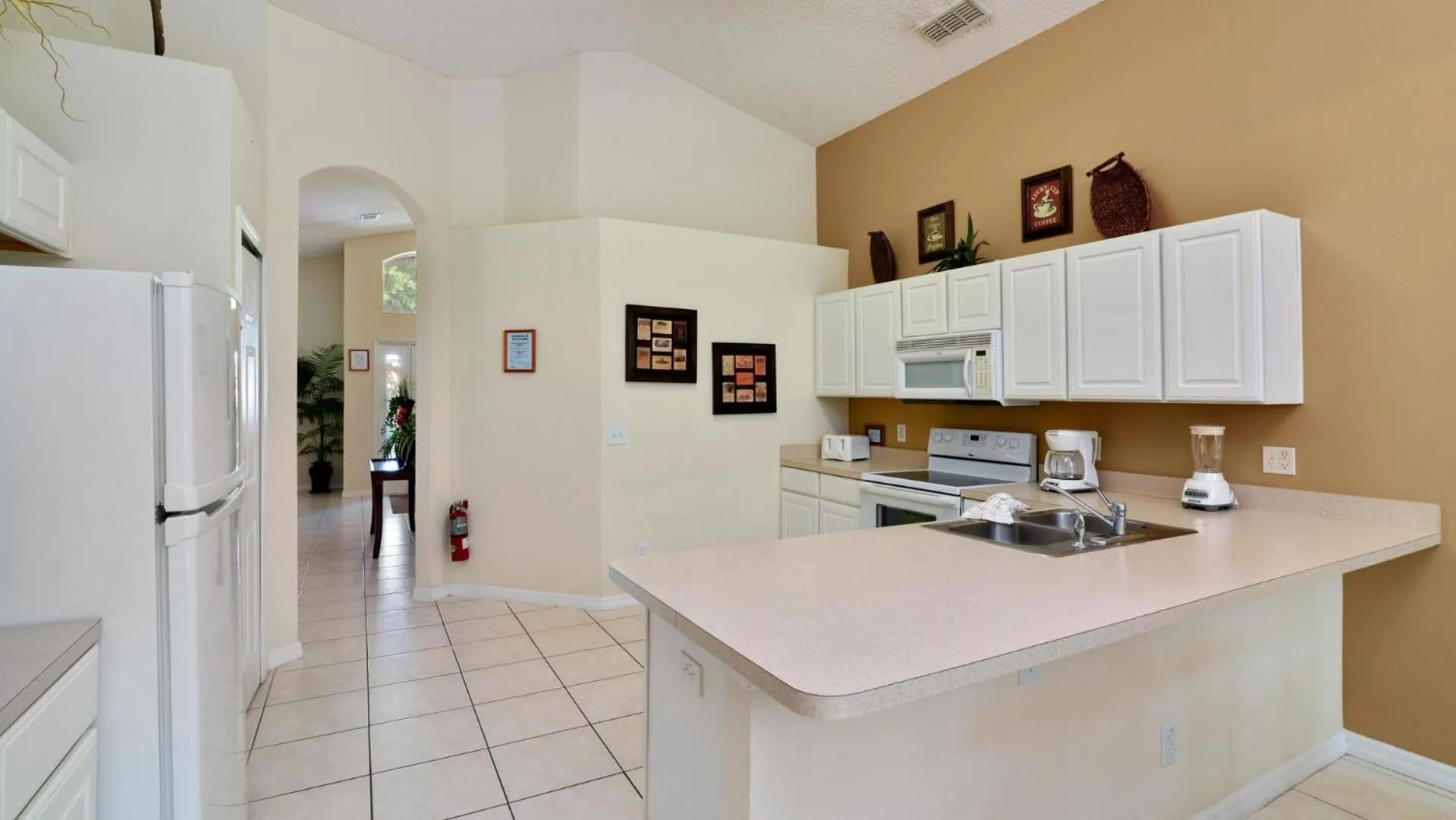 Kitchen or kitchenette in Shooting Star - Family friendly 4 bed pool home on Emerald Island Resort - close to Disney World!