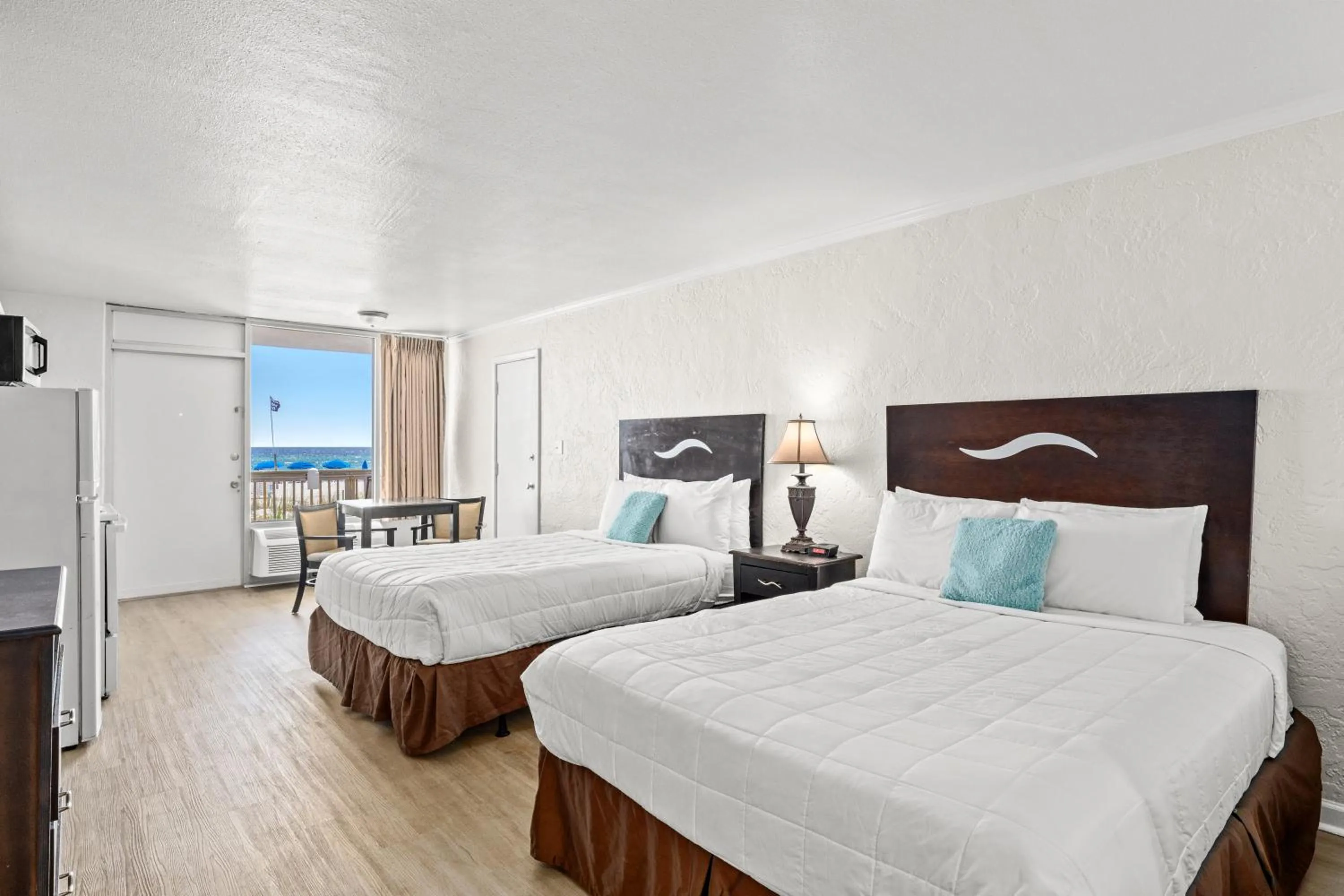 Photo of the whole room, Bed in The Reef At Seahaven Beach Resorts