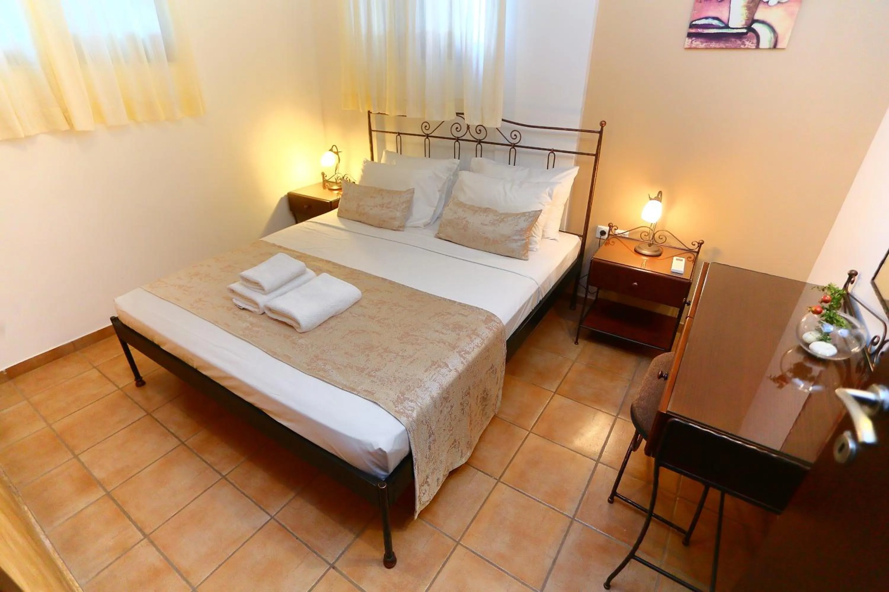 Bed in Vathi Hotel Apartment Hotel