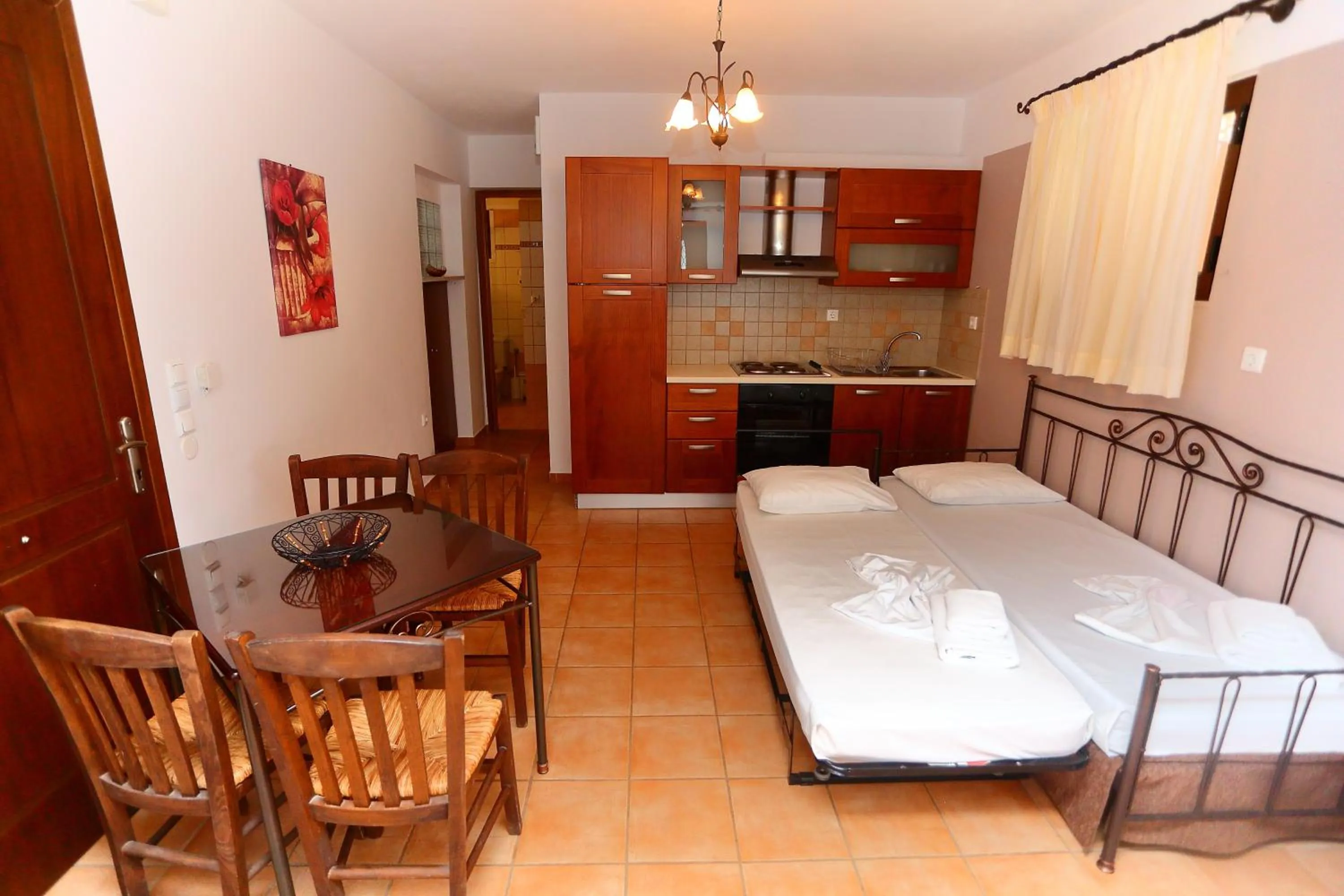 Kitchen or kitchenette, Bed in Vathi Hotel Apartment Hotel