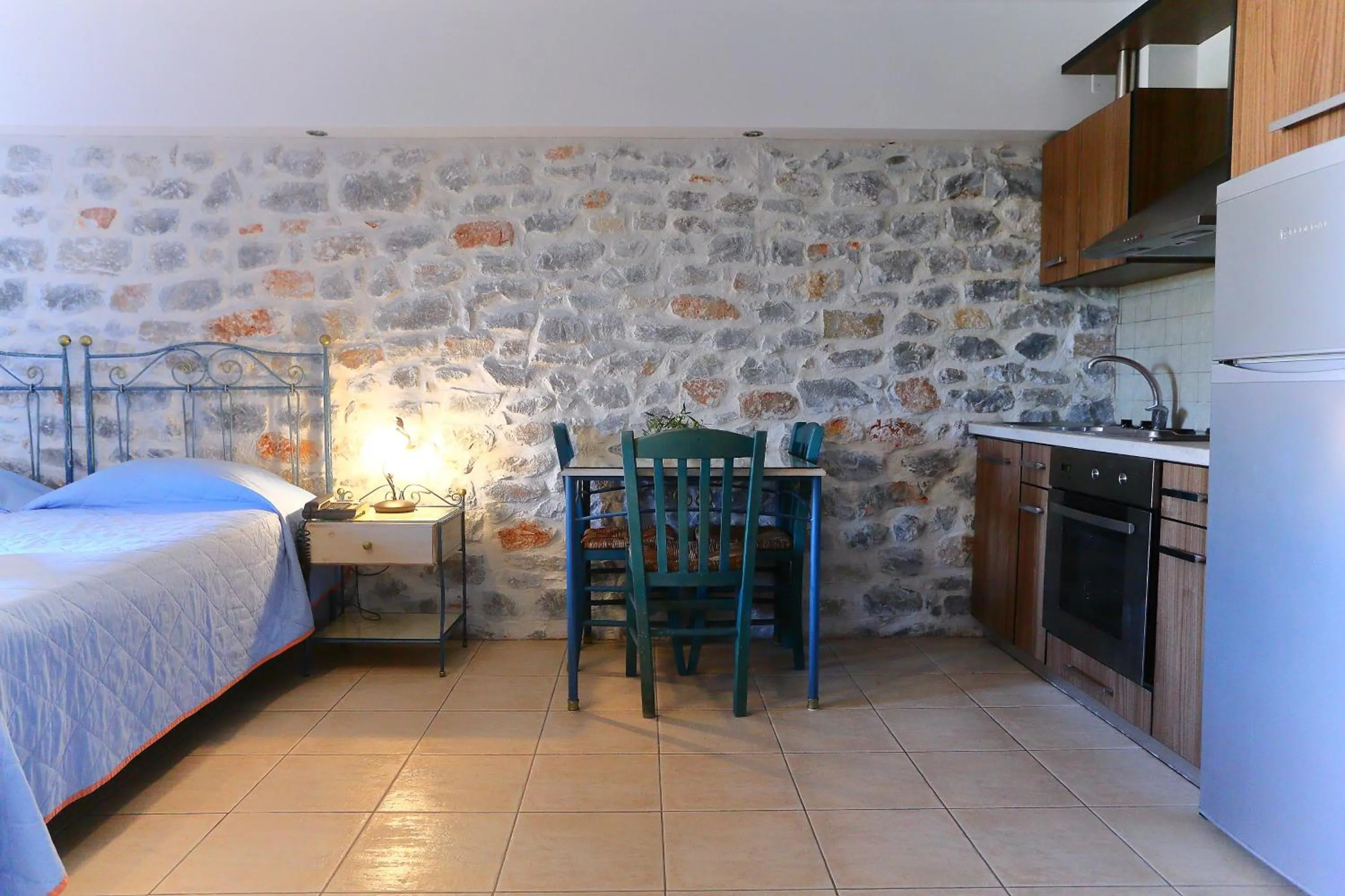 Kitchen or kitchenette, Bed in Vathi Hotel Apartment Hotel