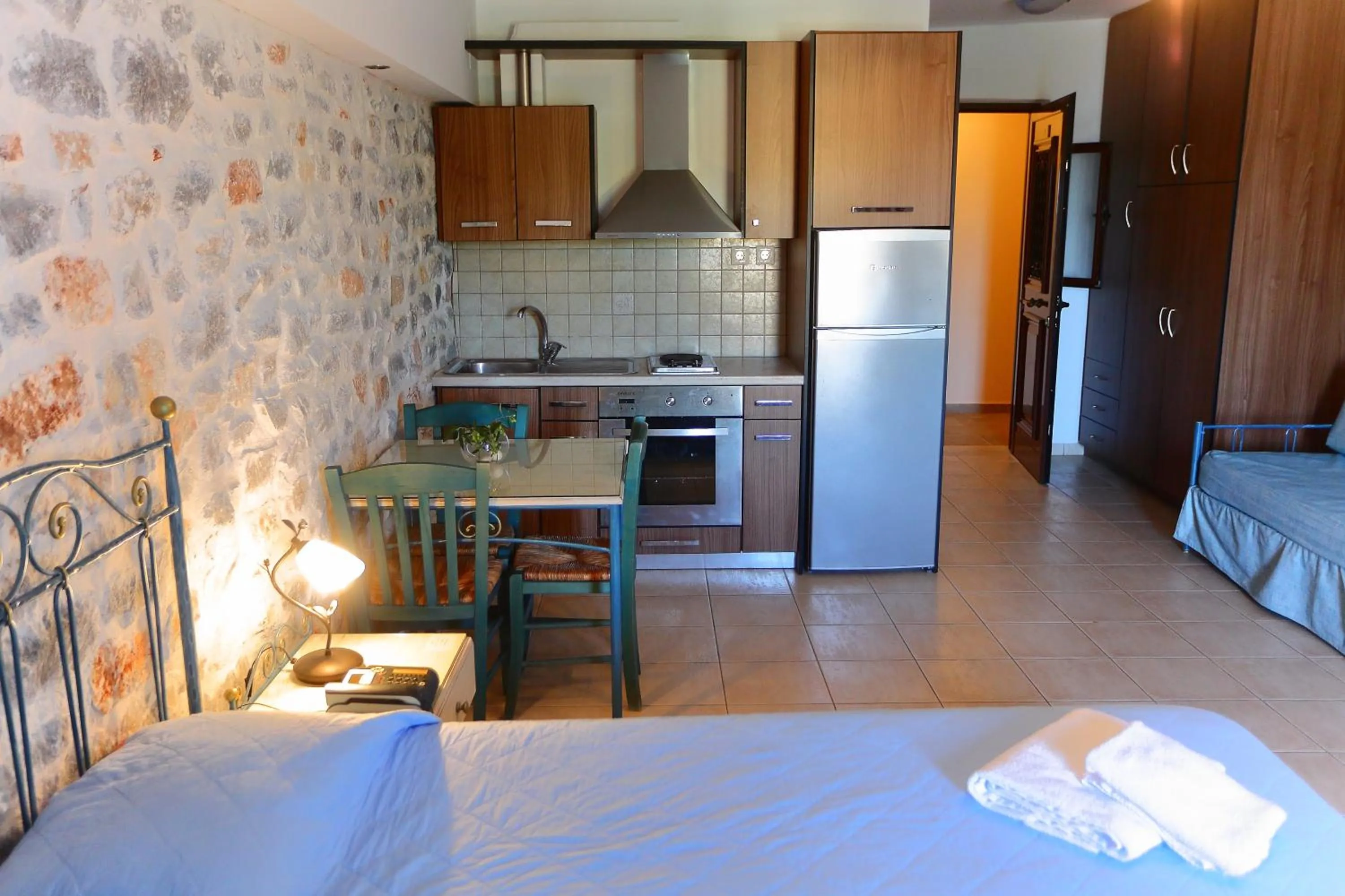 Kitchen or kitchenette, Bed in Vathi Hotel Apartment Hotel