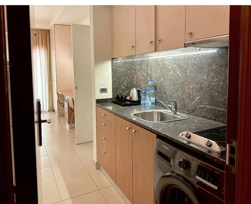 Kitchen or kitchenette in Hayali Suites