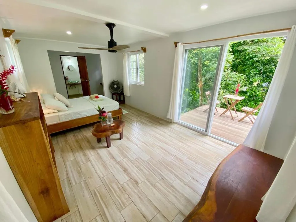 Bed in Bird Island Bungalows