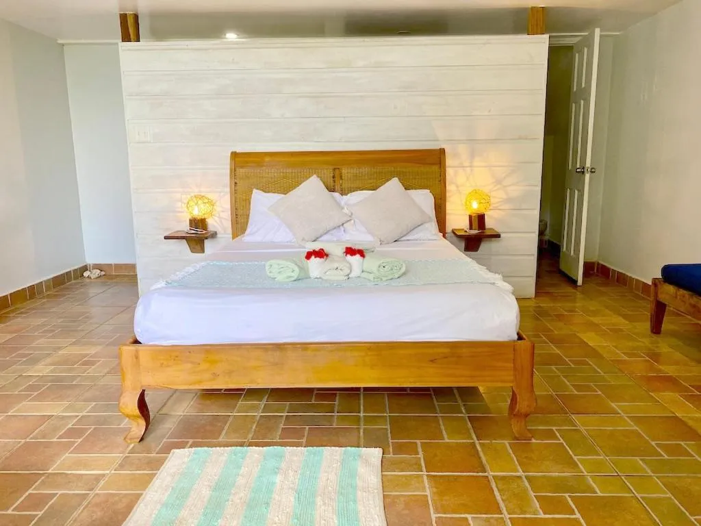 Bed in Bird Island Bungalows