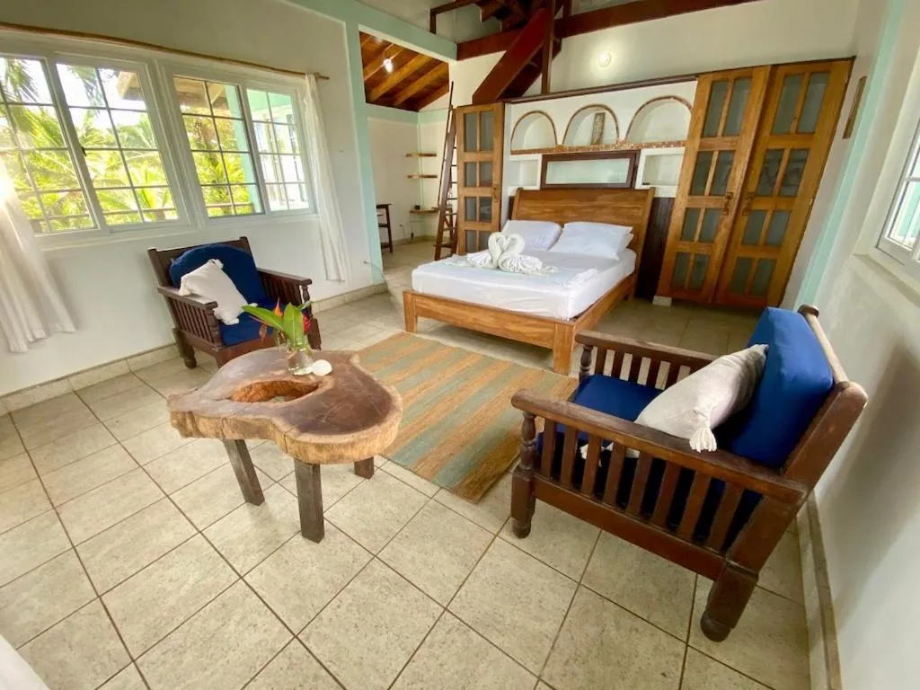 Bed in Bird Island Bungalows
