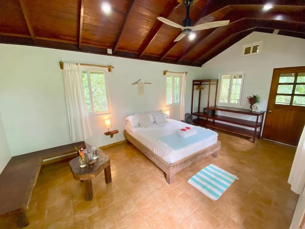 Bed in Bird Island Bungalows