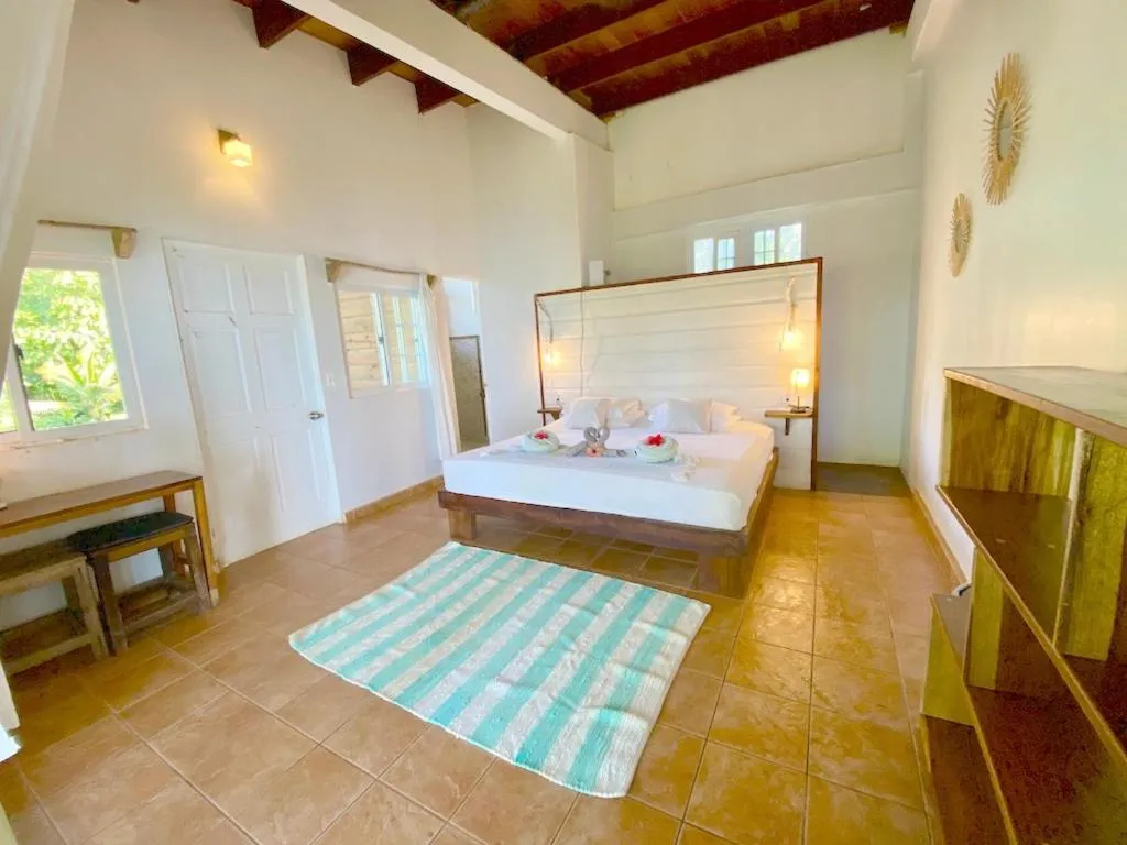 Bed in Bird Island Bungalows