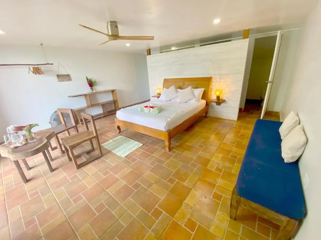 Bed in Bird Island Bungalows