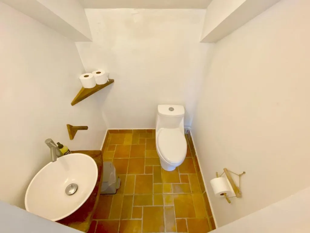 Toilet in Bird Island Bungalows