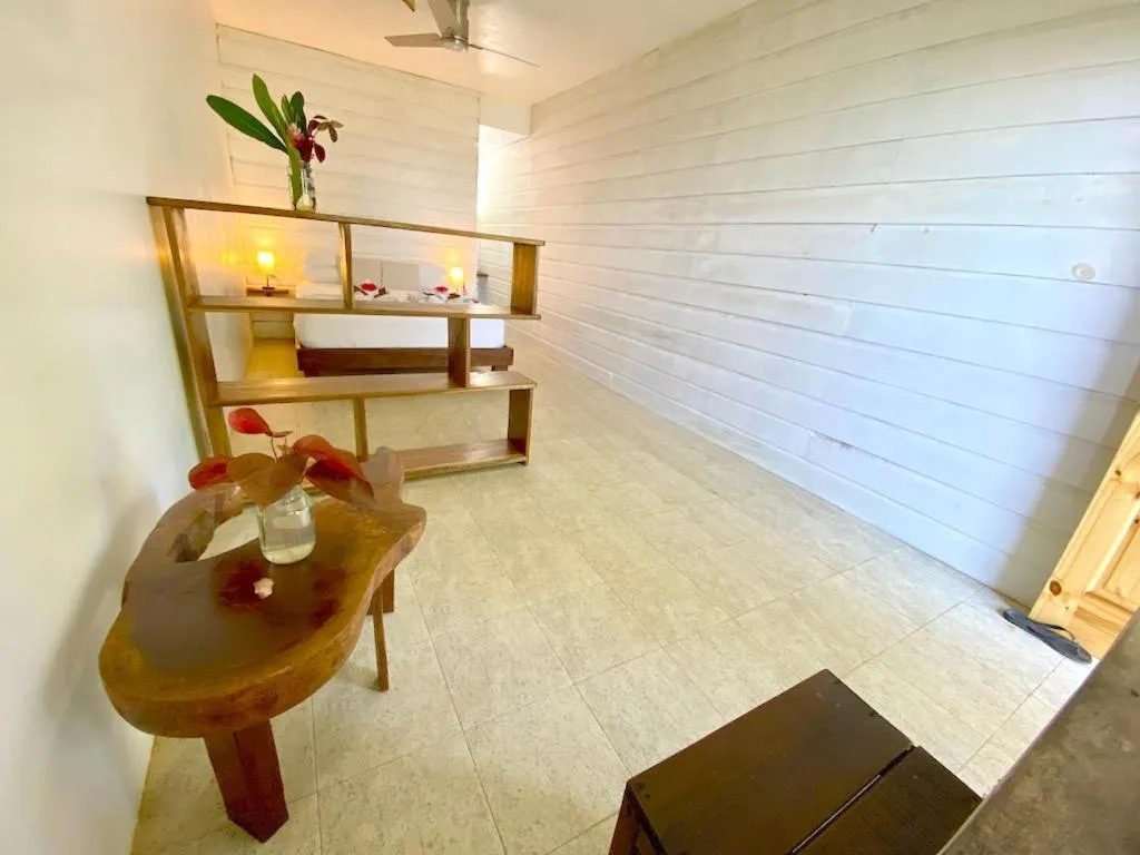 Bed in Bird Island Bungalows